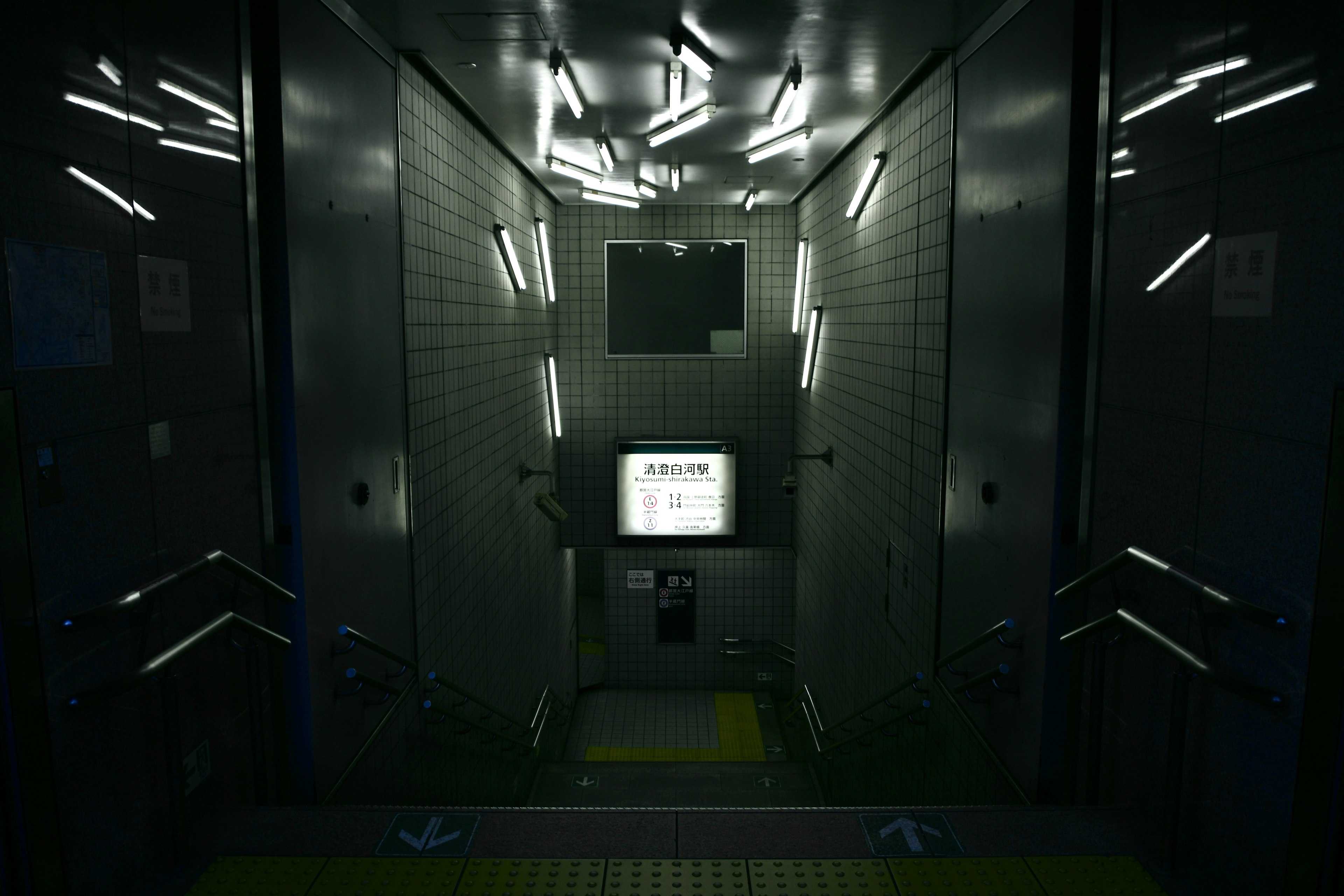 Interior of a dark elevator with striking bright light strips