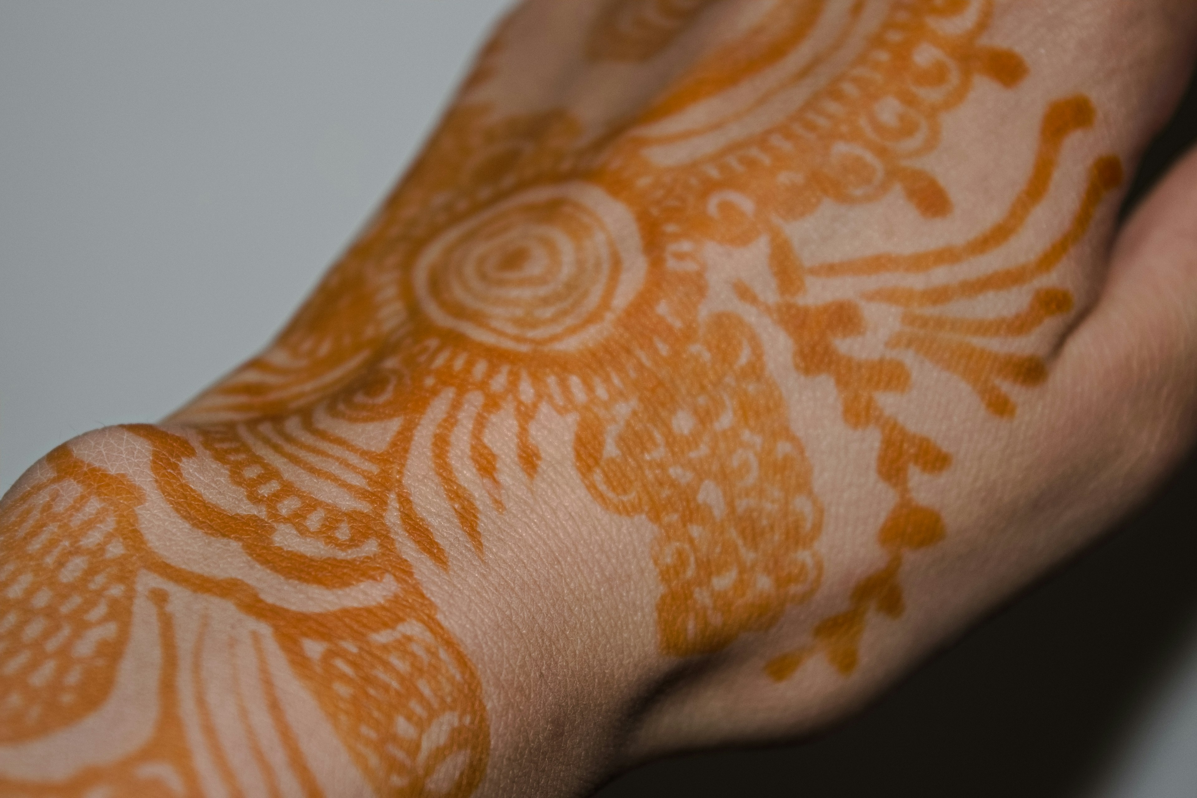 Beautiful henna art on the hand featuring intricate designs