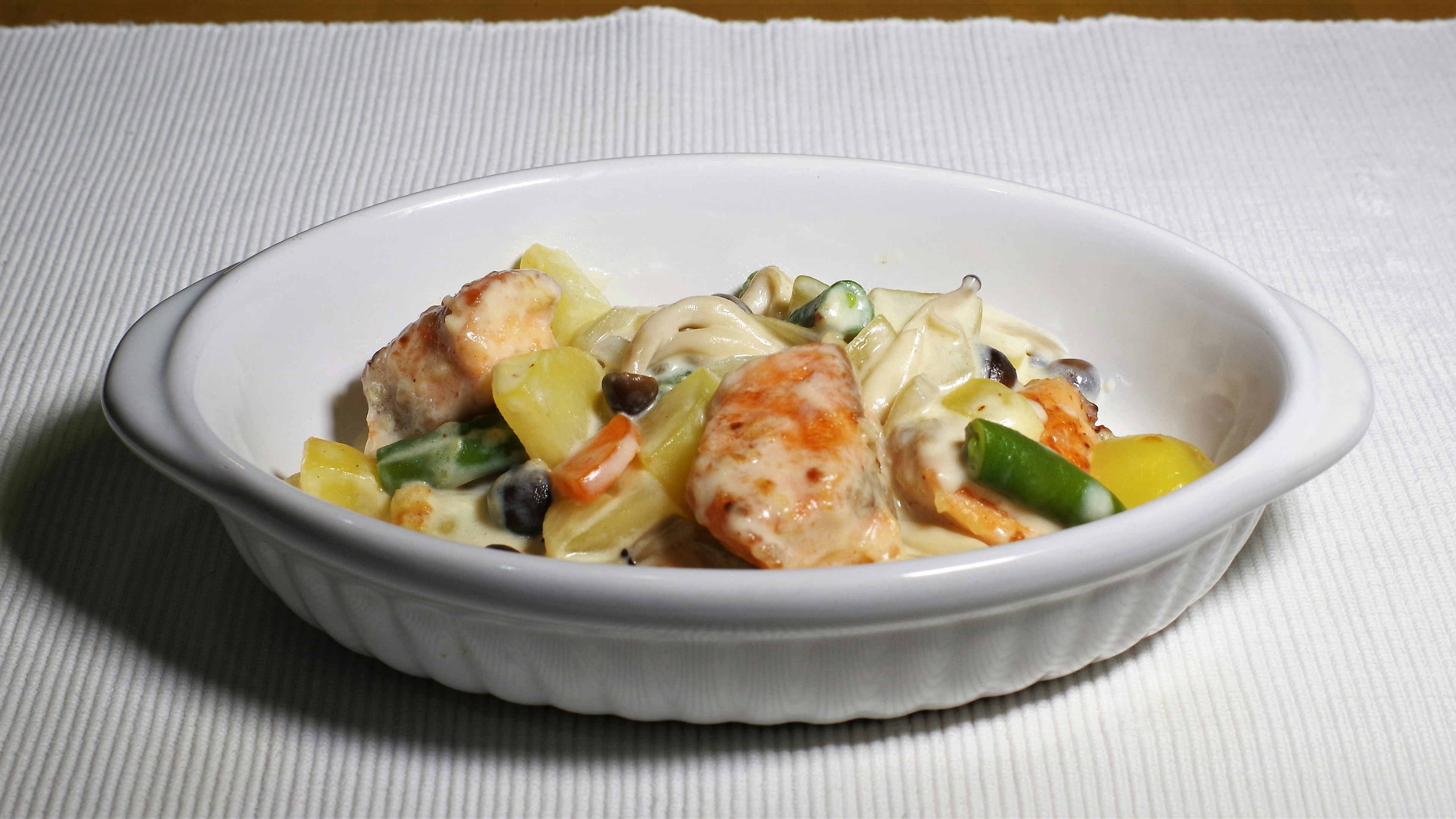 Pasta dish with cream sauce and assorted vegetables