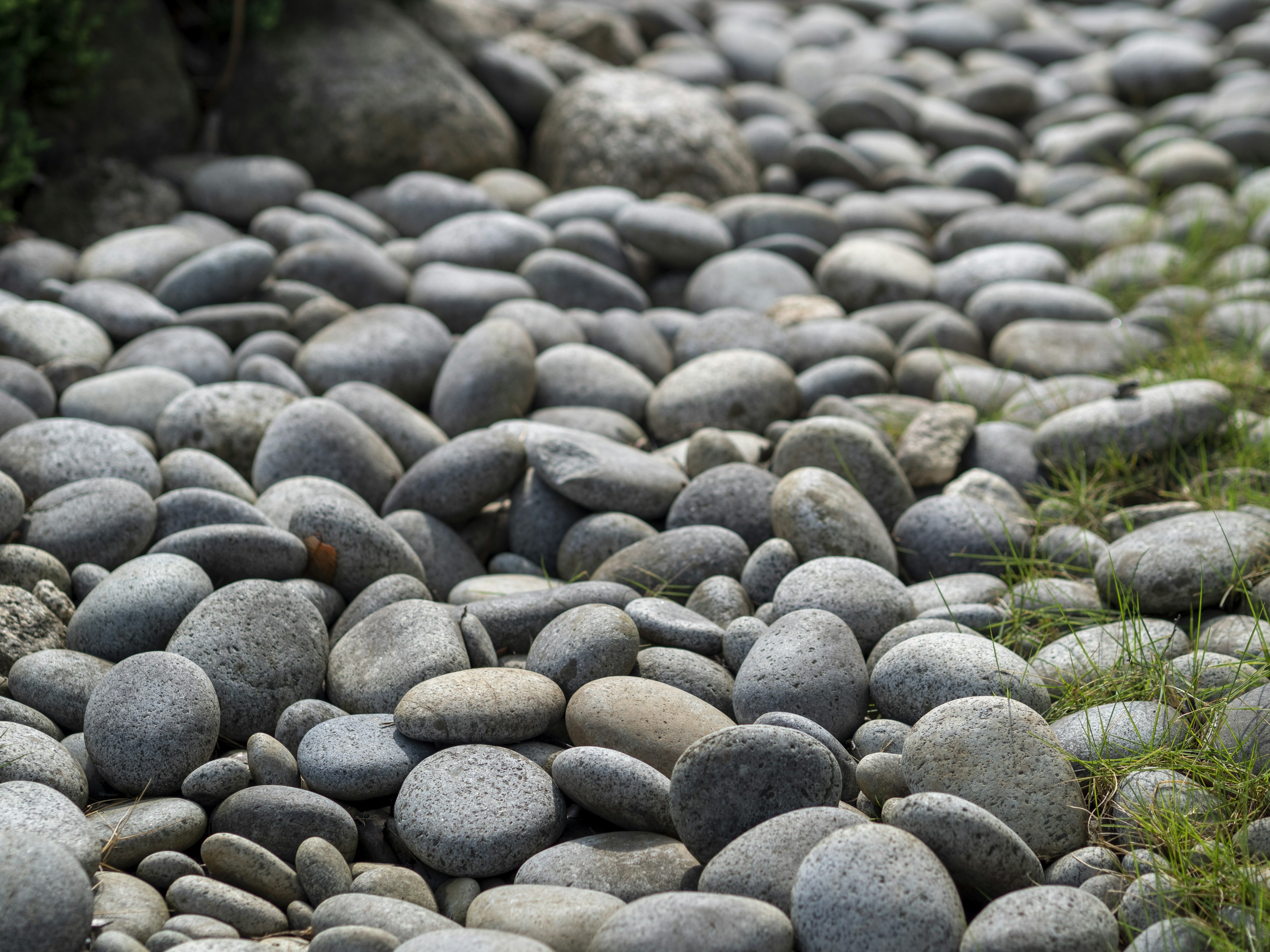 A landscape featuring smooth pebbles arranged in a natural setting