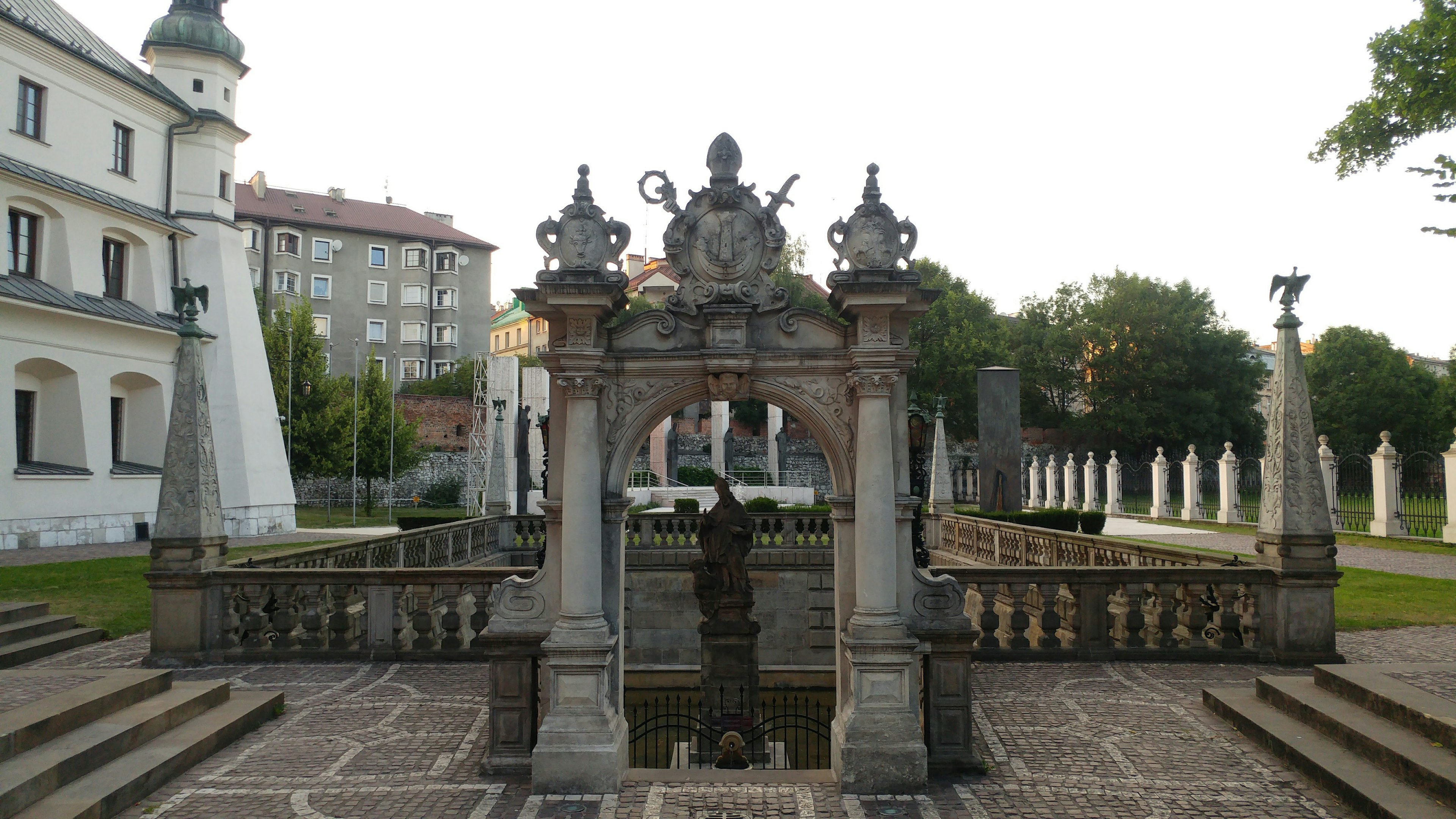 Beautiful stone fountain with sculptures in a garden setting