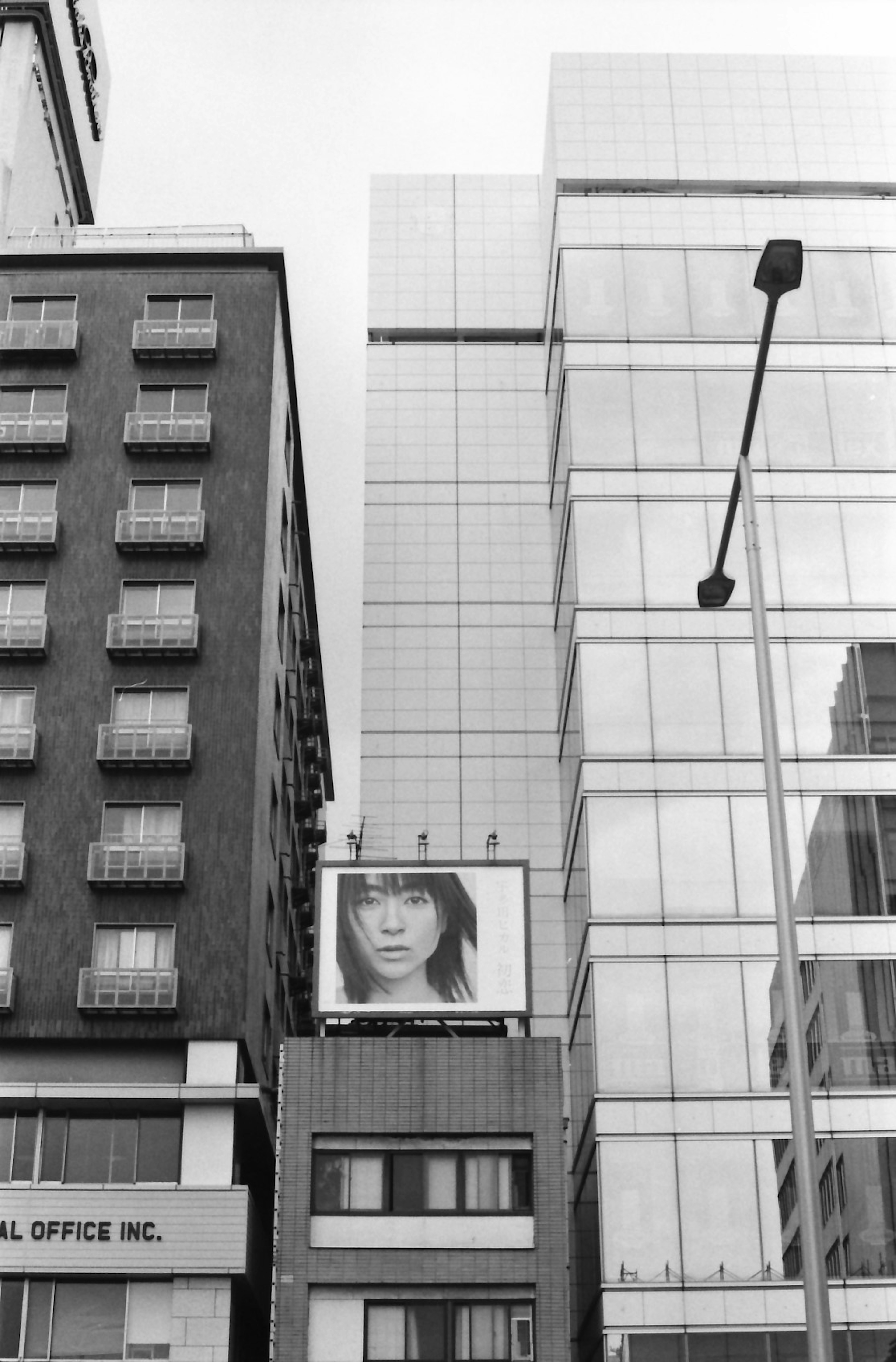 Urban scene featuring a large billboard on a building wall