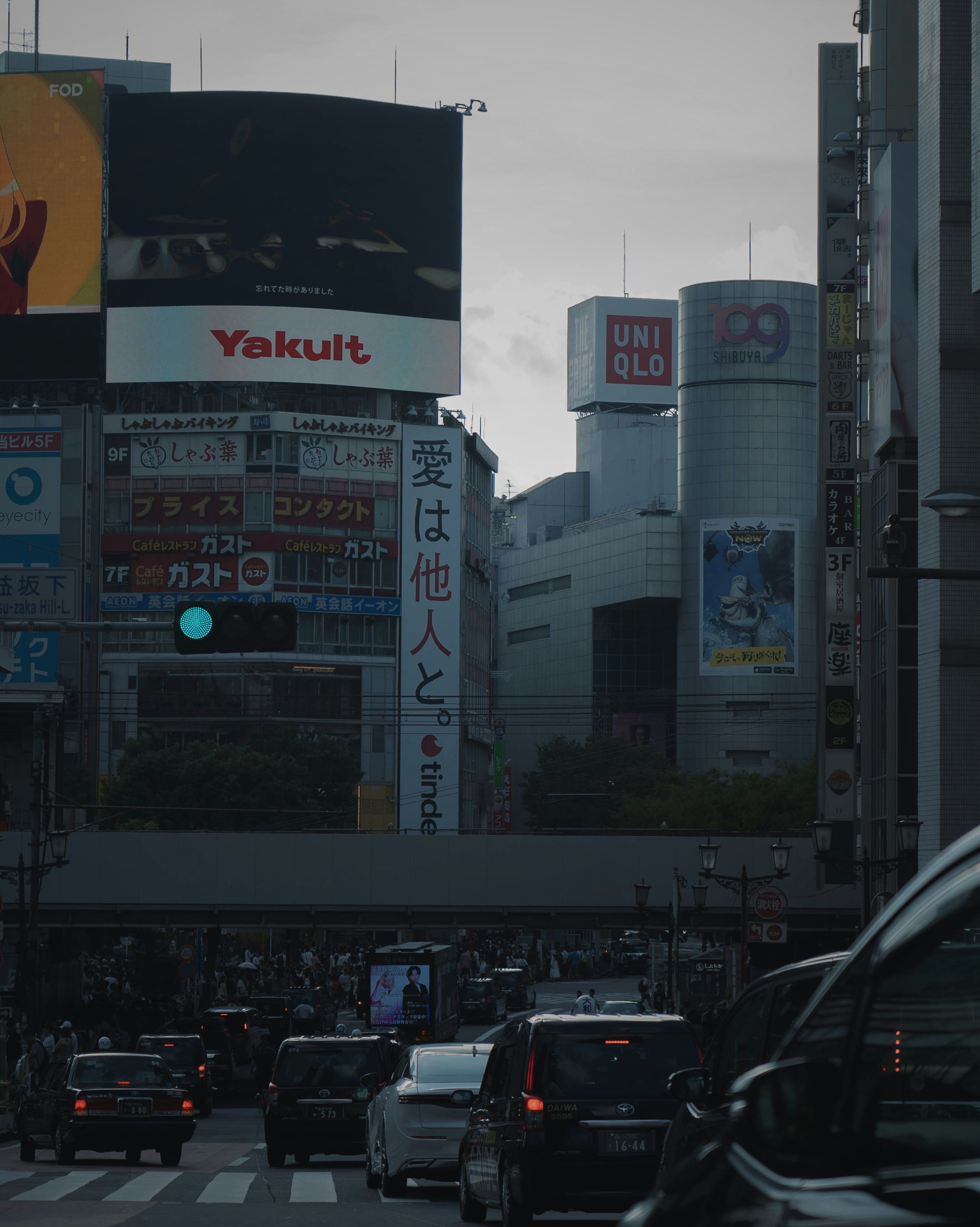 Urban scene featuring buildings and traffic lights in a bustling area