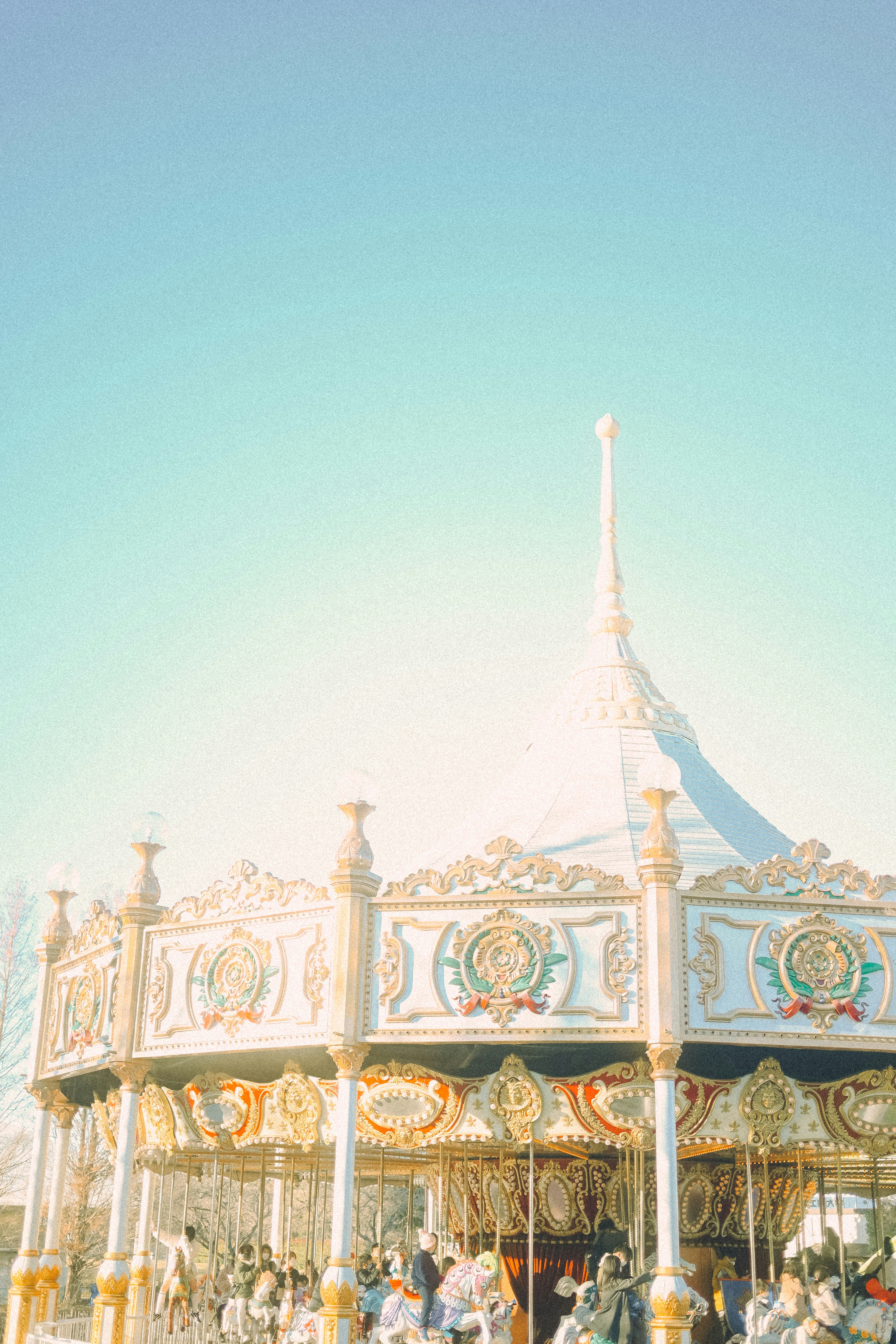 A beautiful carousel under a blue sky