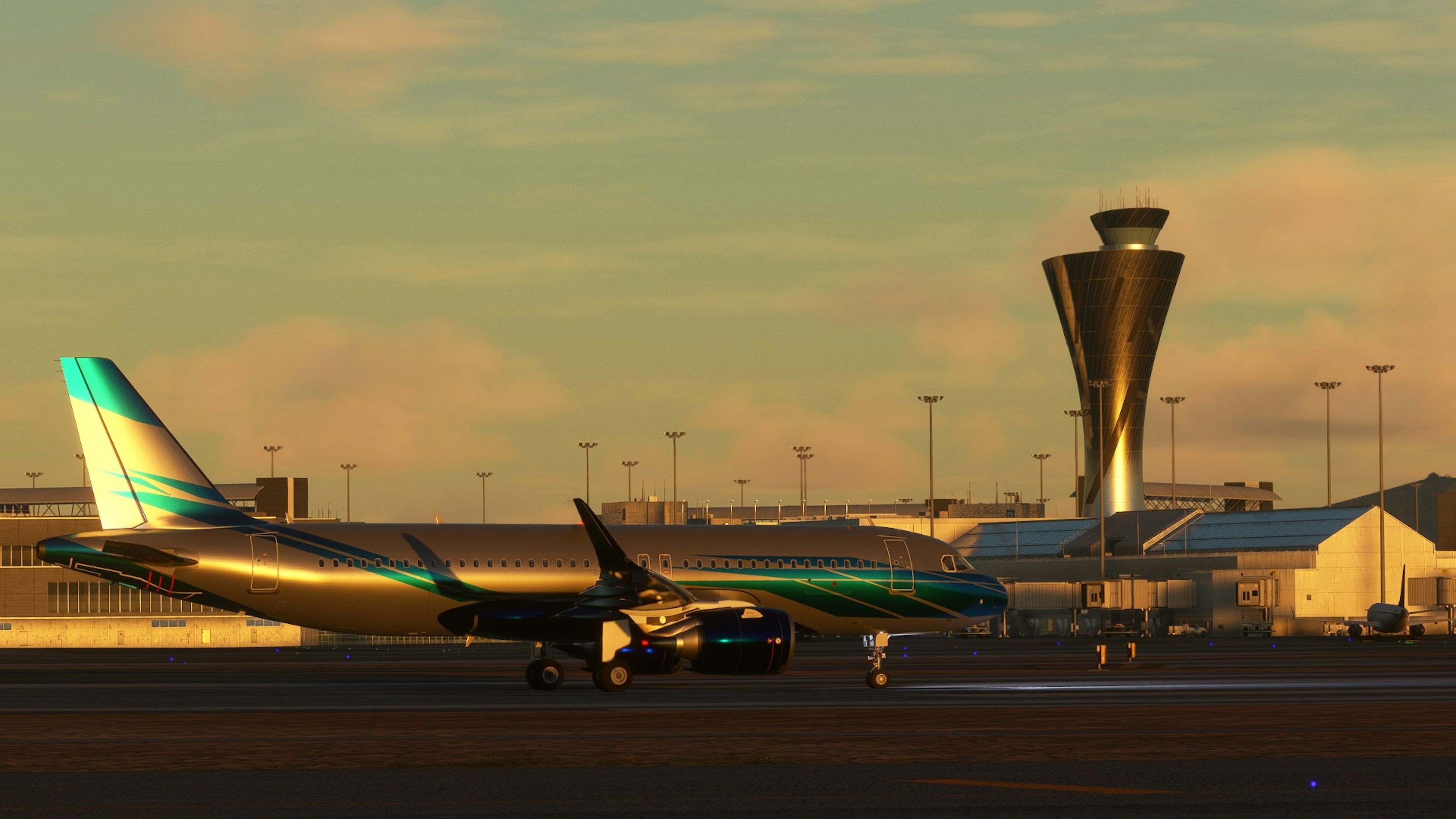 An airplane parked on an airport runway with a control tower in the background