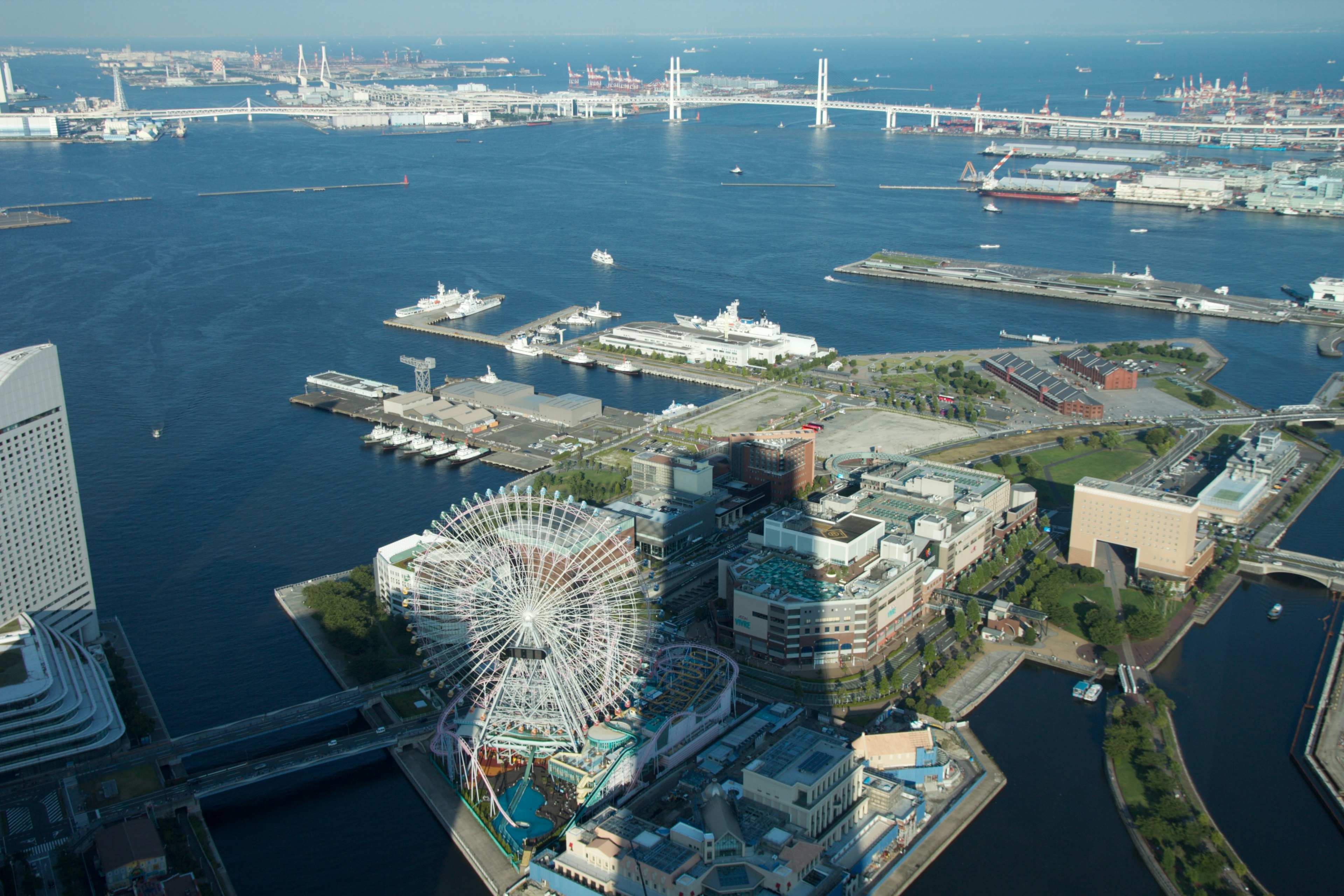 Aerial view of Yokohama port featuring a Ferris wheel