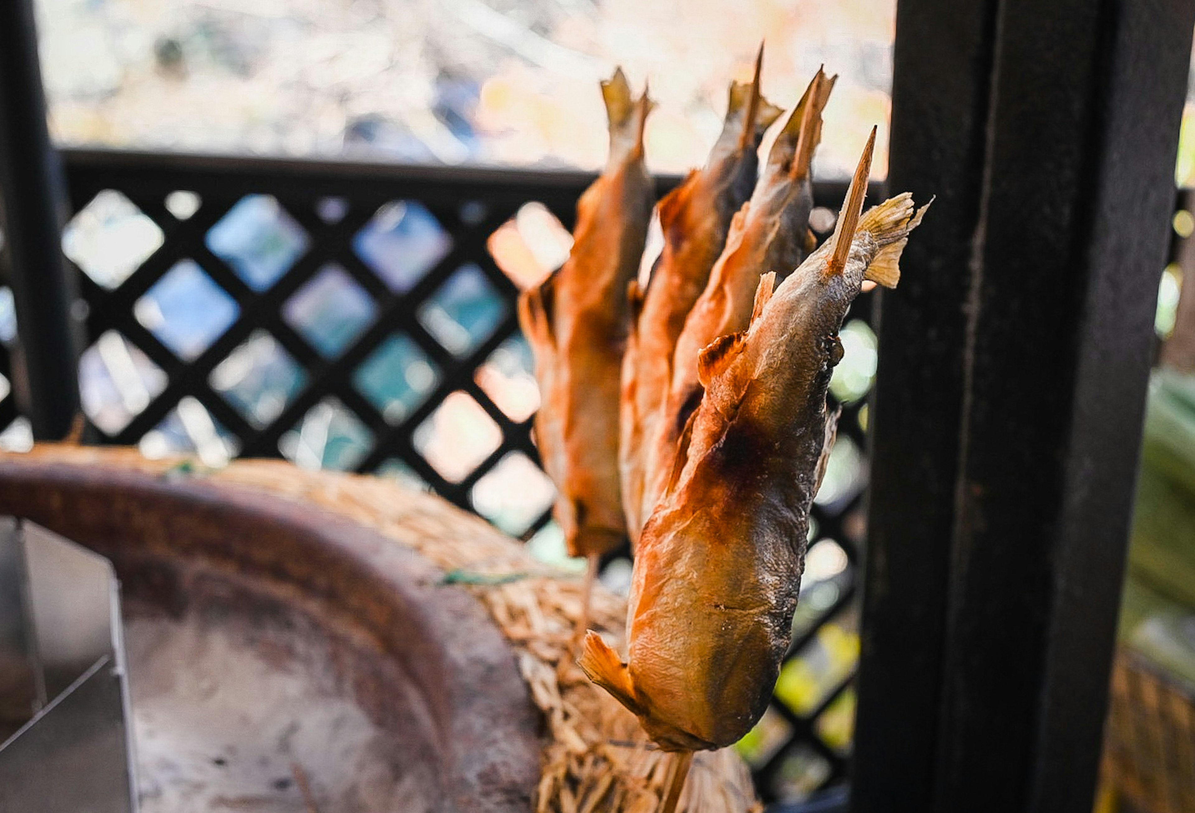 Smoked fish hanging in a market setting