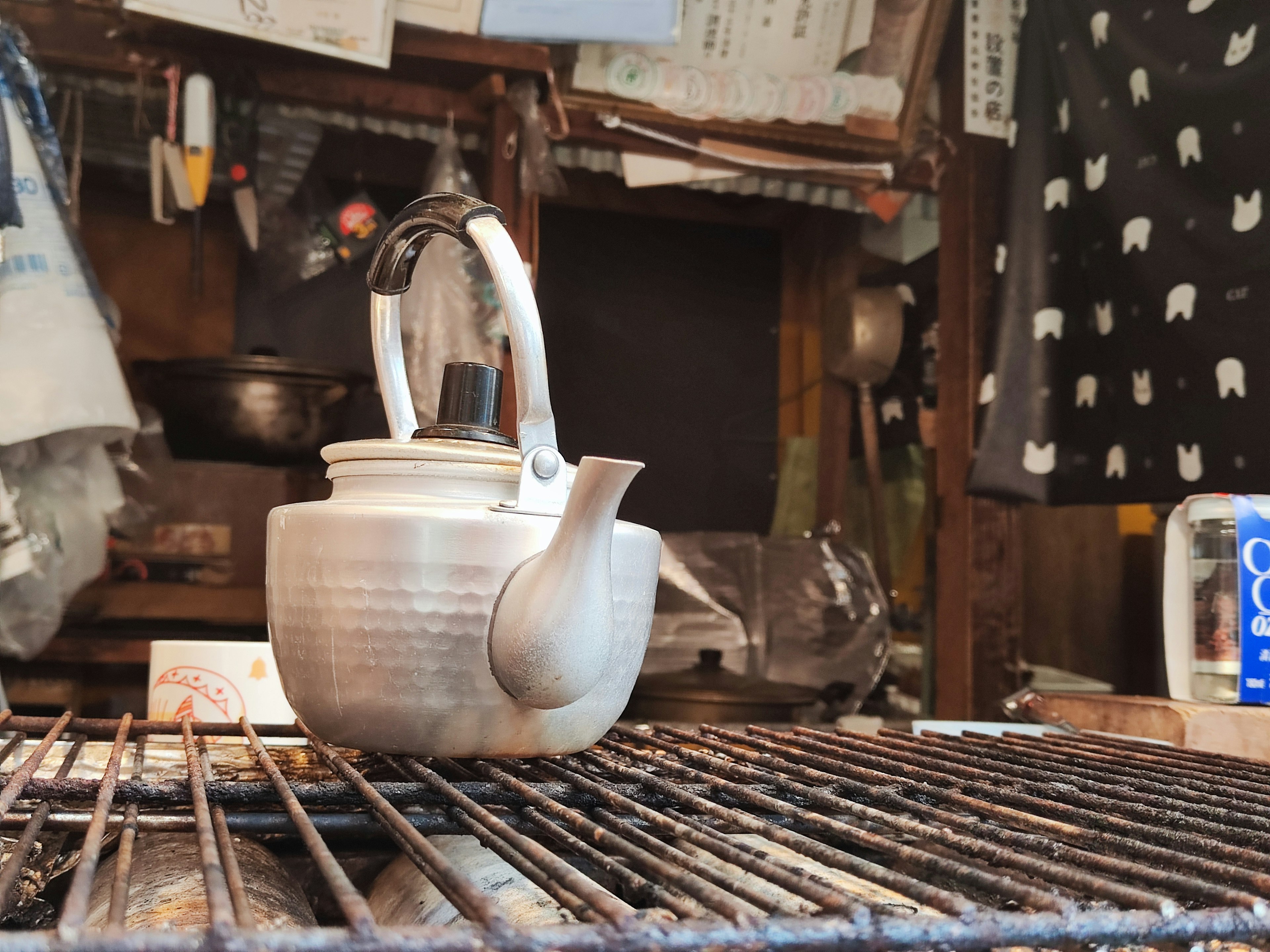 Traditional kettle resting on a metal grate