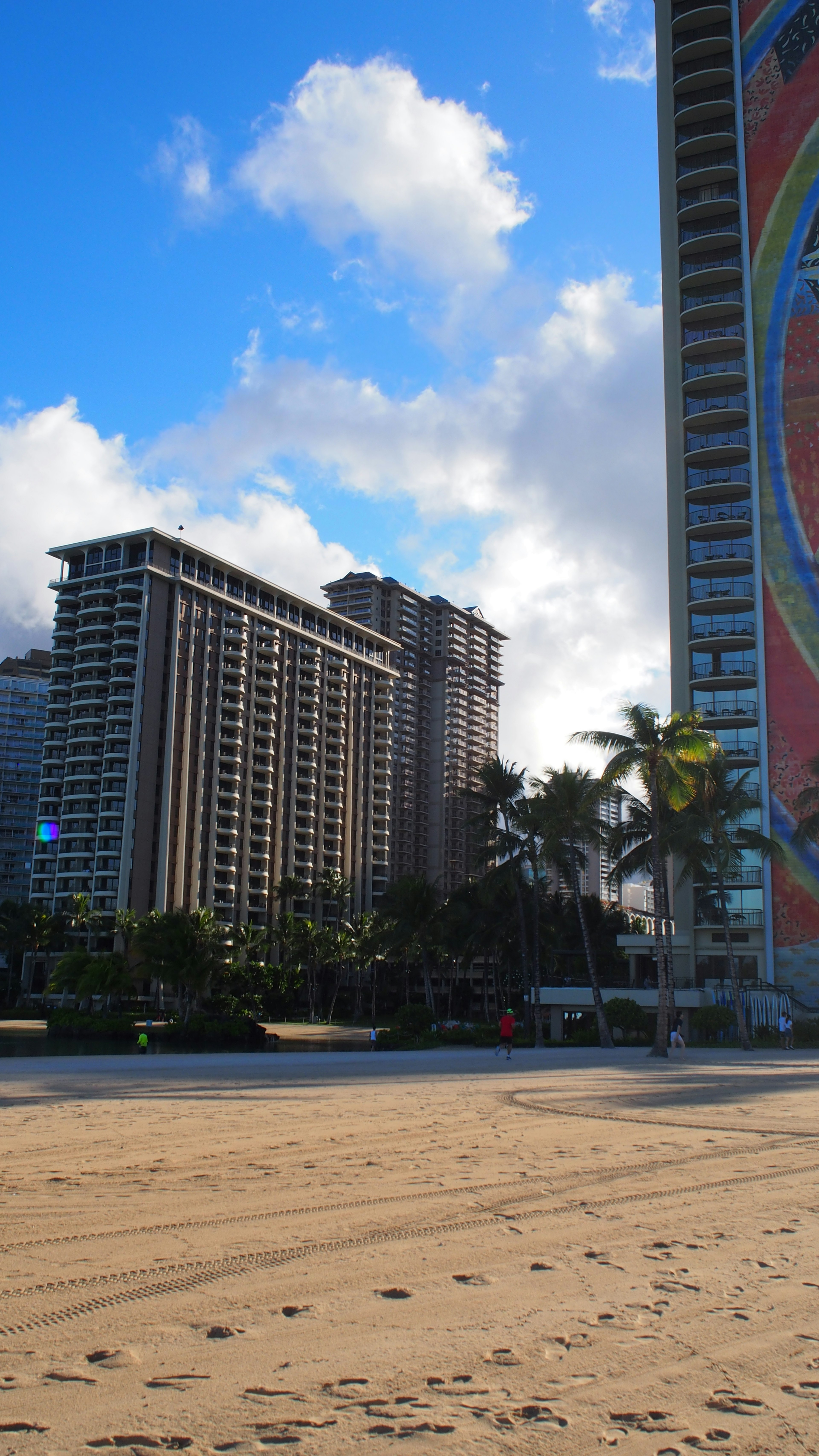 High-rise buildings near the beach under a blue sky