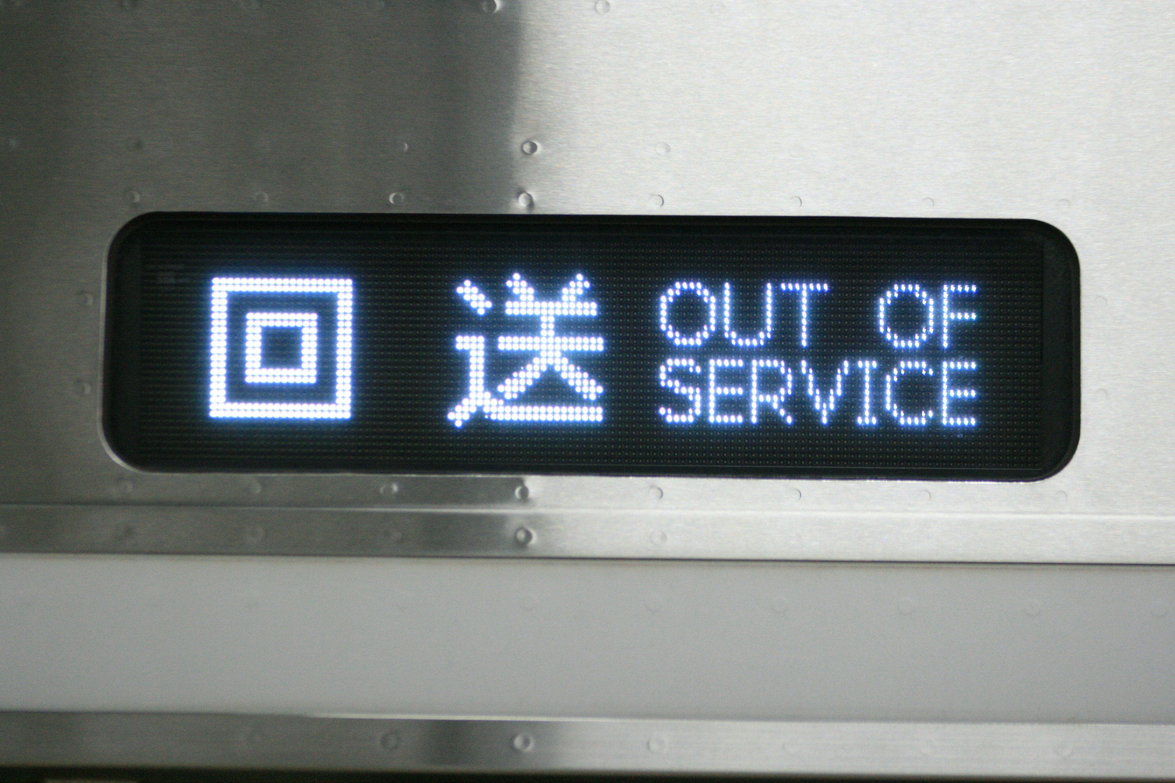 Elevator display panel showing 'OUT OF SERVICE' sign