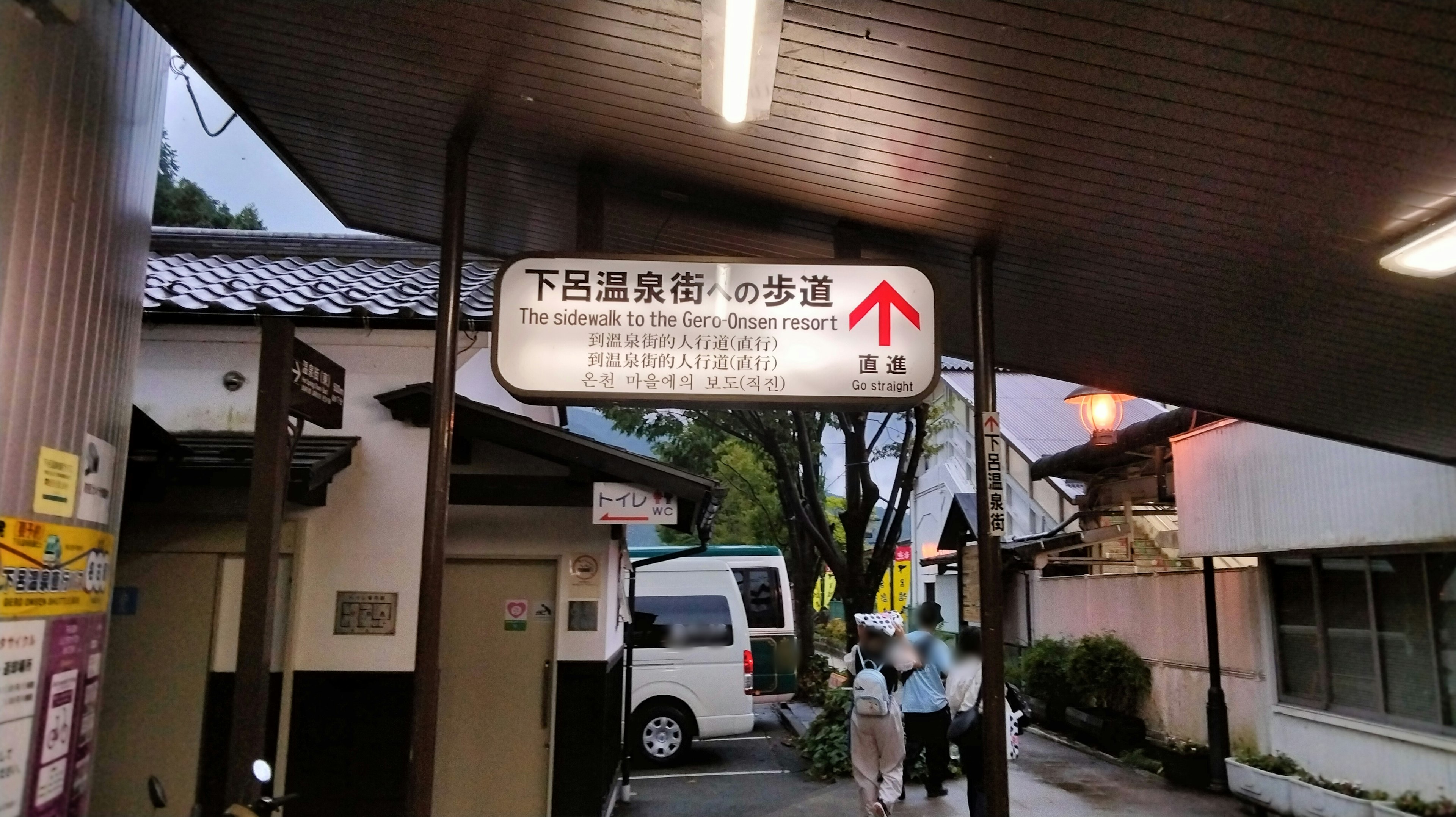 Street scene featuring a directional sign and surrounding environment