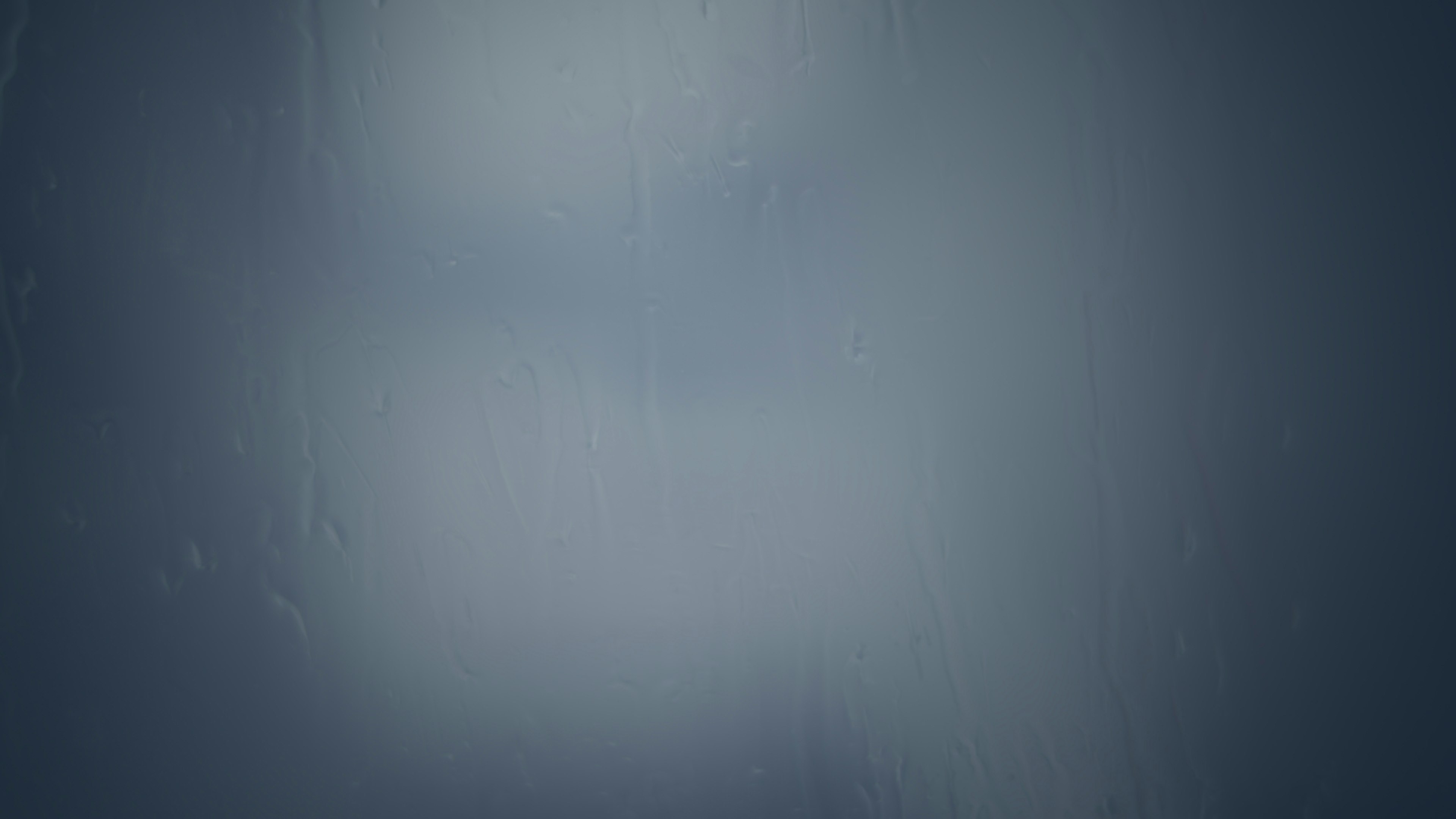 Blurred abstract background in shades of blue and gray