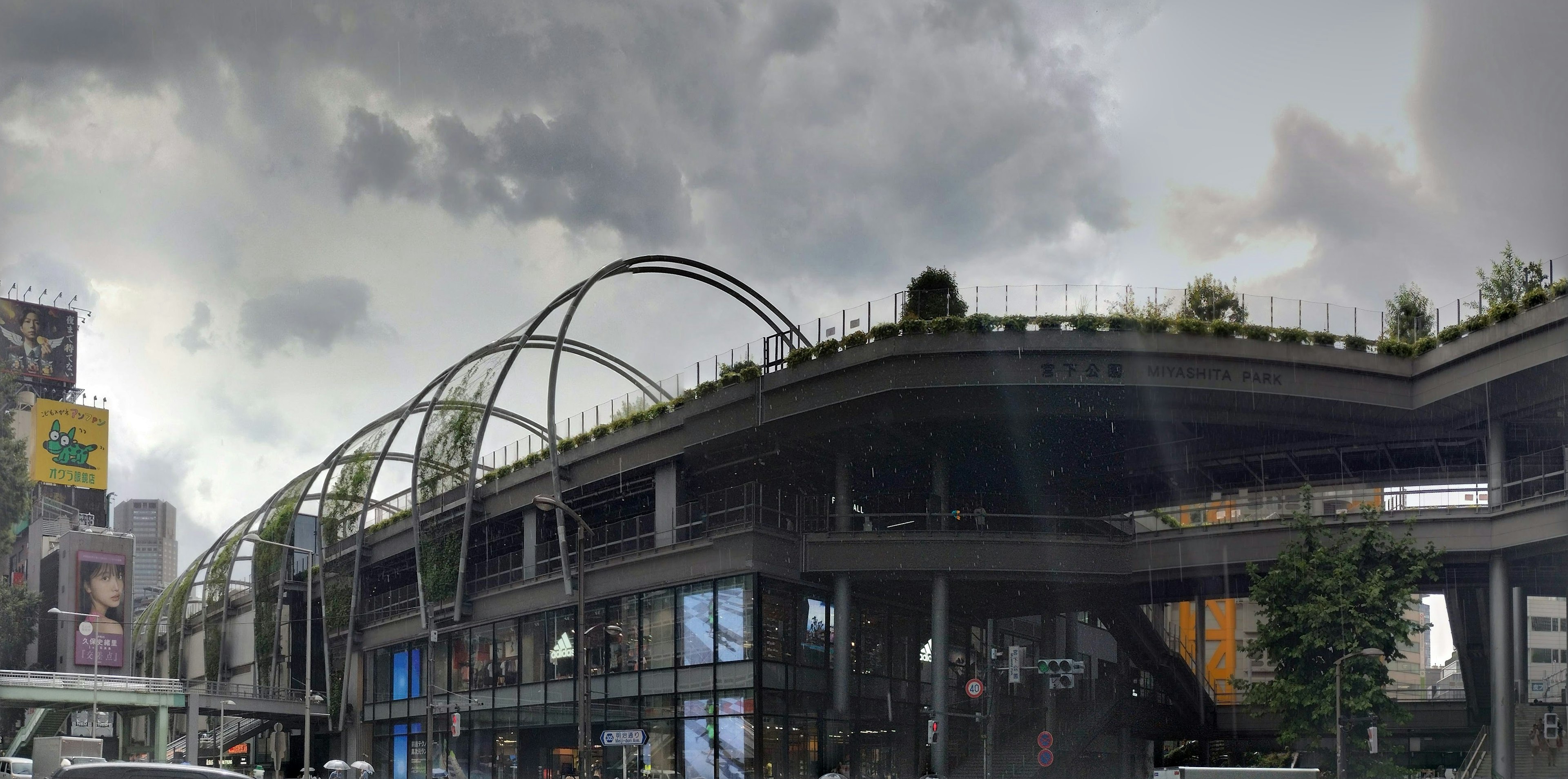 Urban landscape featuring a modern building and dark clouds