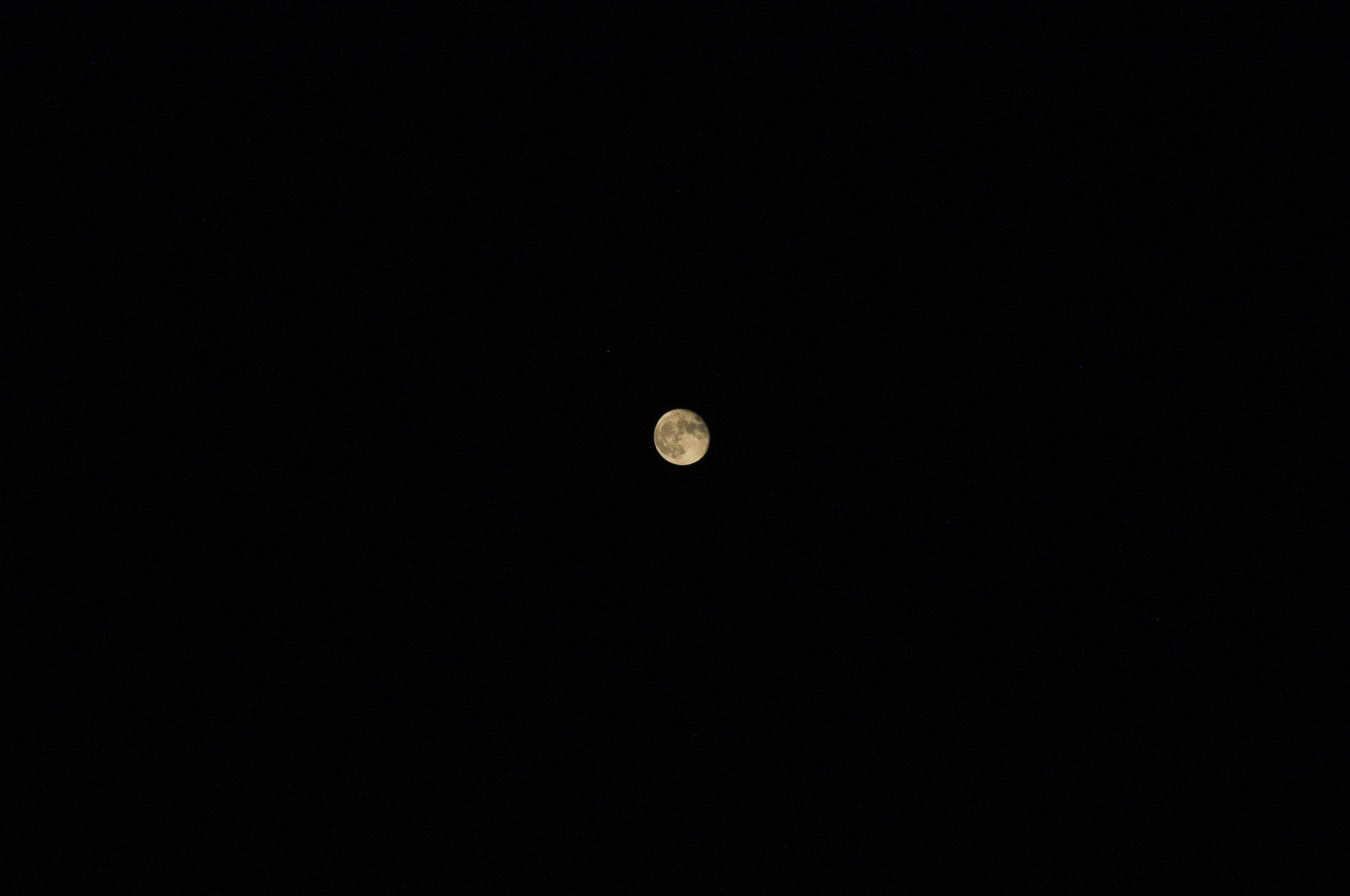 Bright moon visible against a dark background