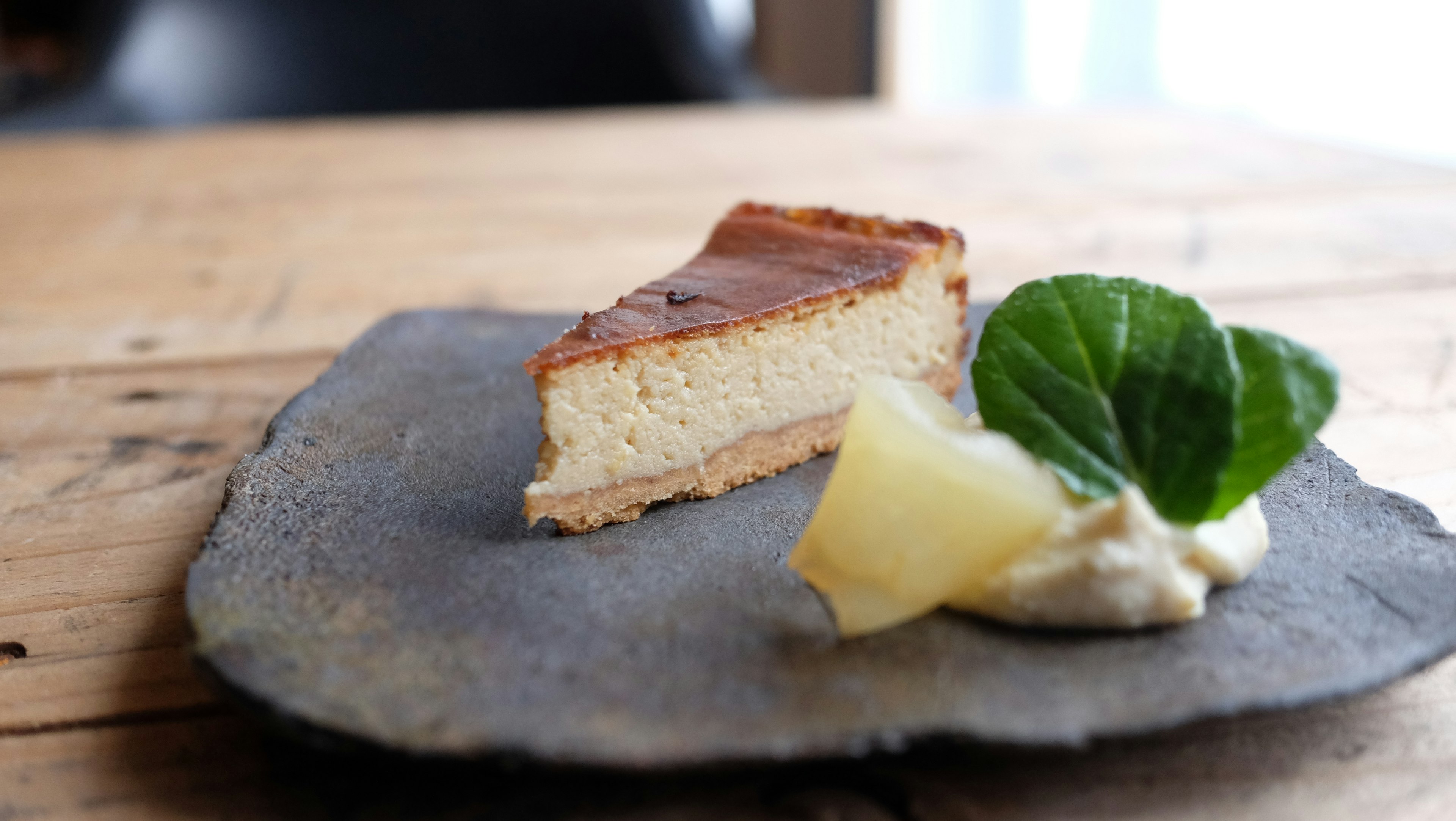 Slice of cheesecake with fruit garnish