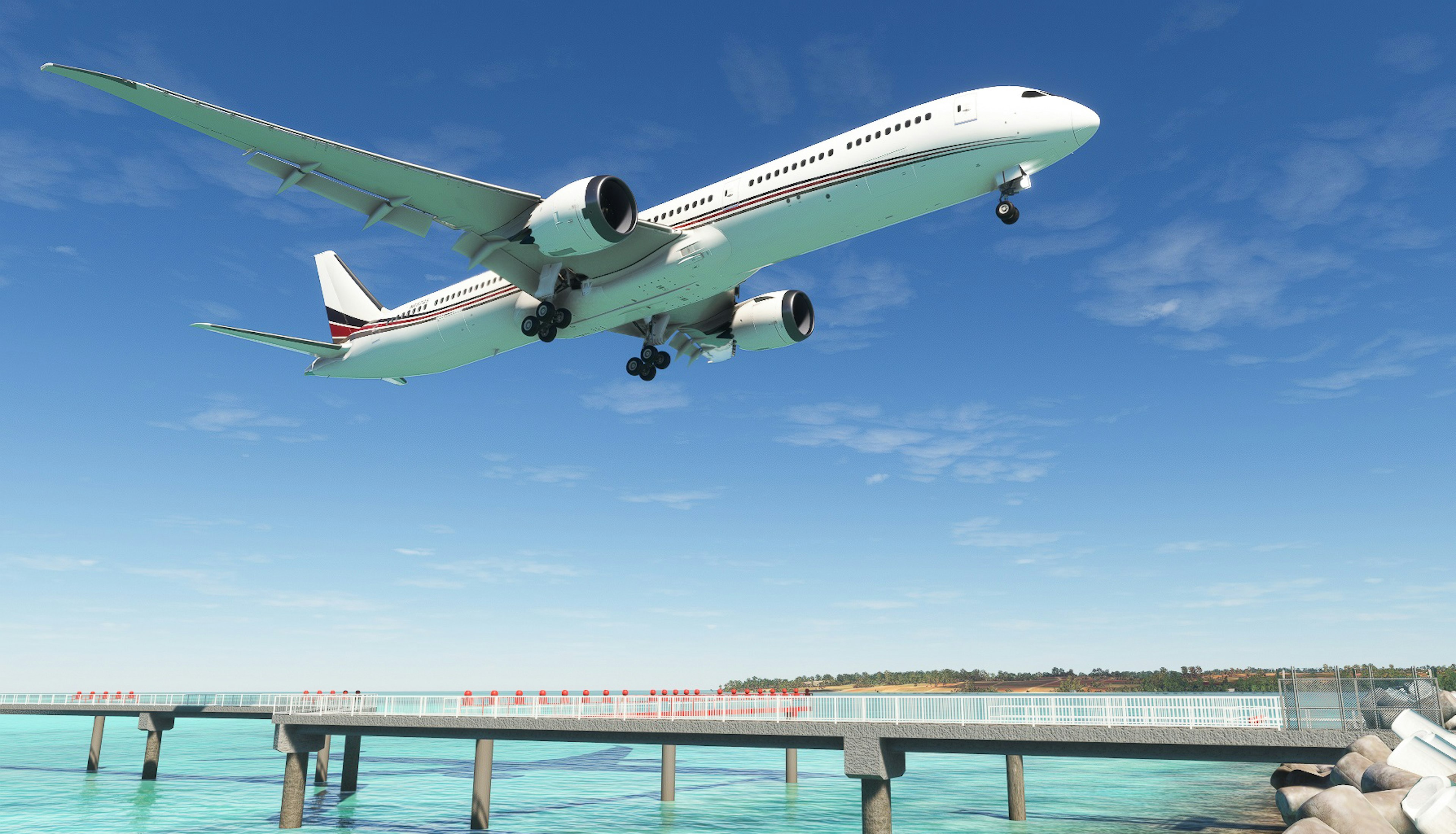 Avión volando bajo contra un cielo azul y un muelle