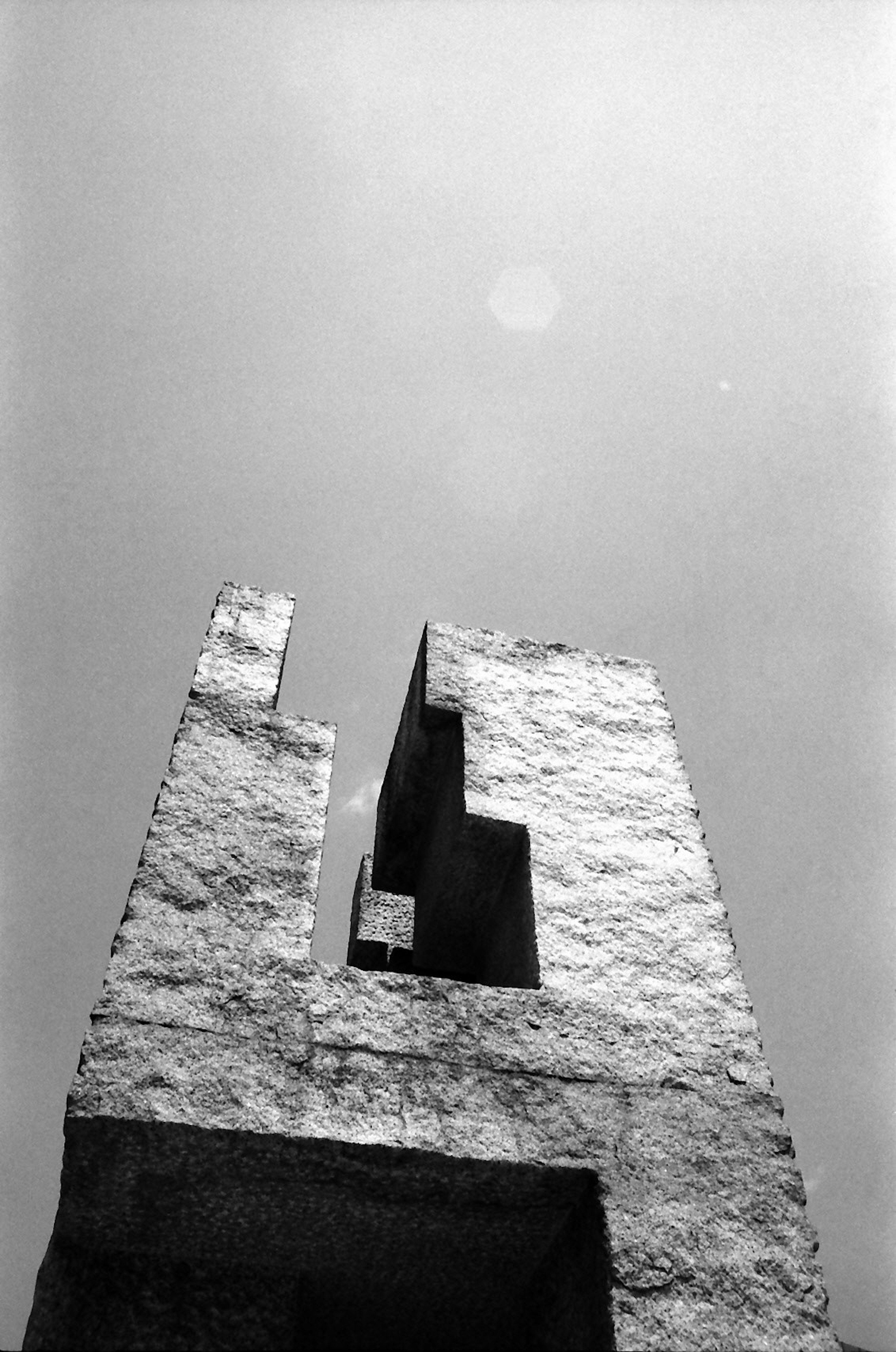 A towering sculptural structure against a clear sky