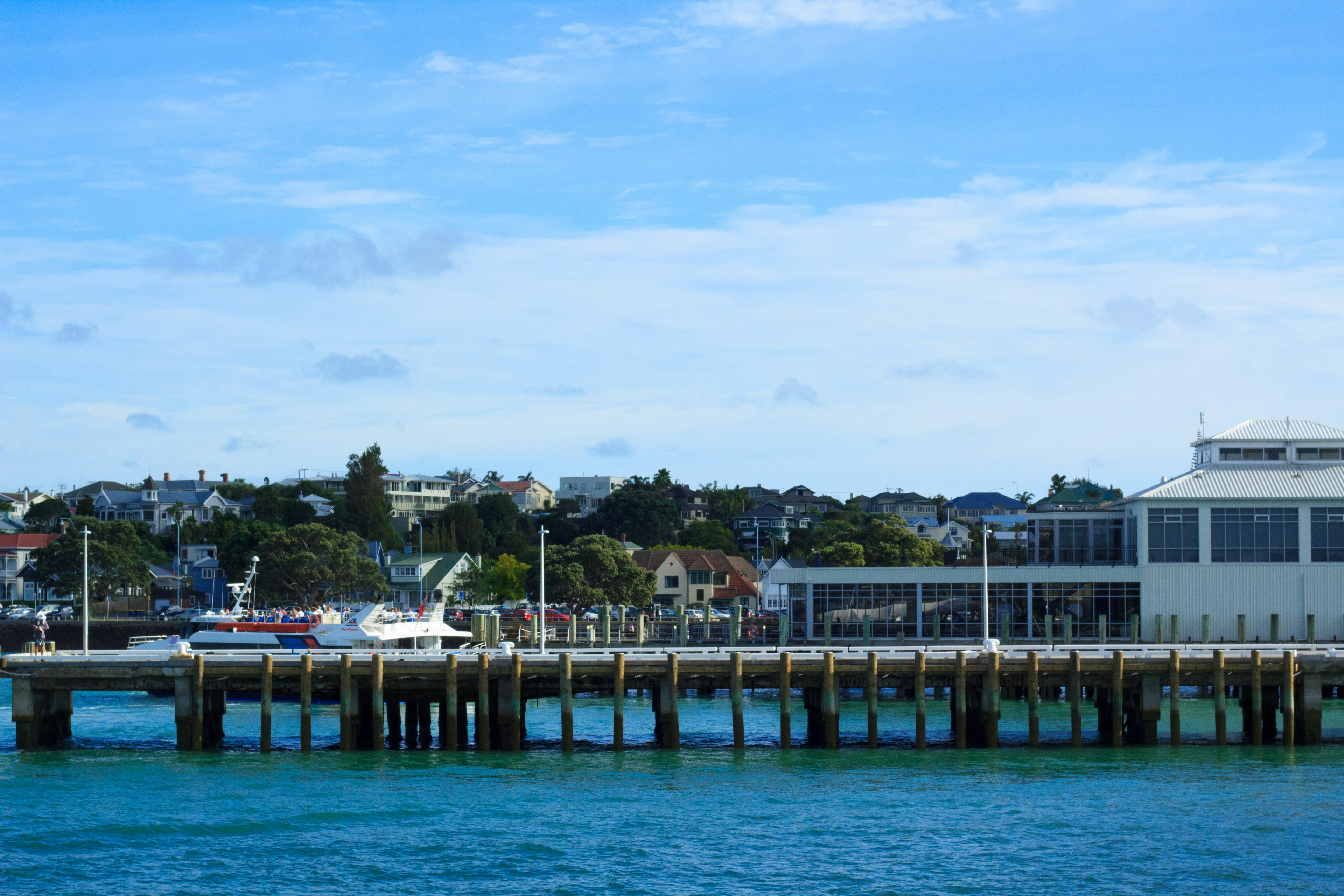 Pier and harbor view under blue sky and water