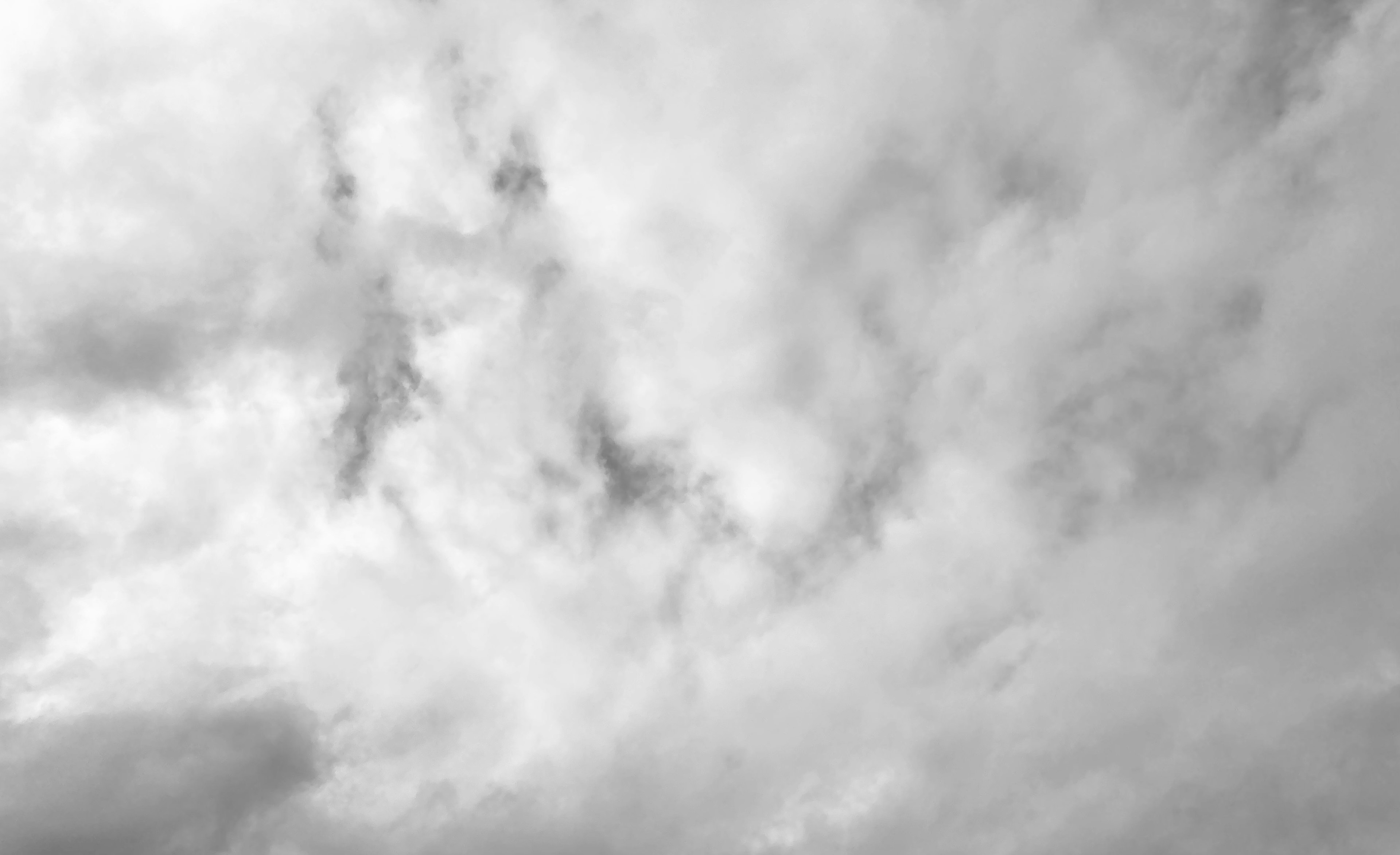 A landscape of gray clouds covering the sky