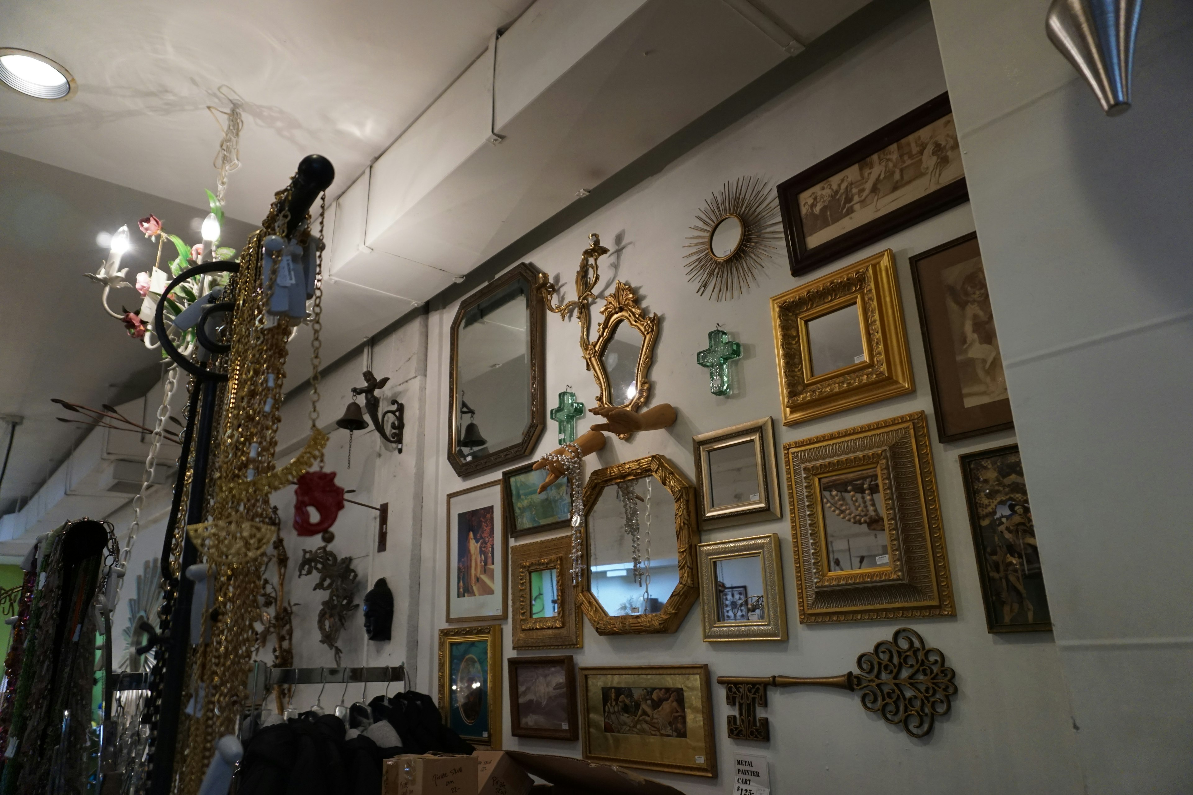 Display of decorative mirrors and frames on a wall