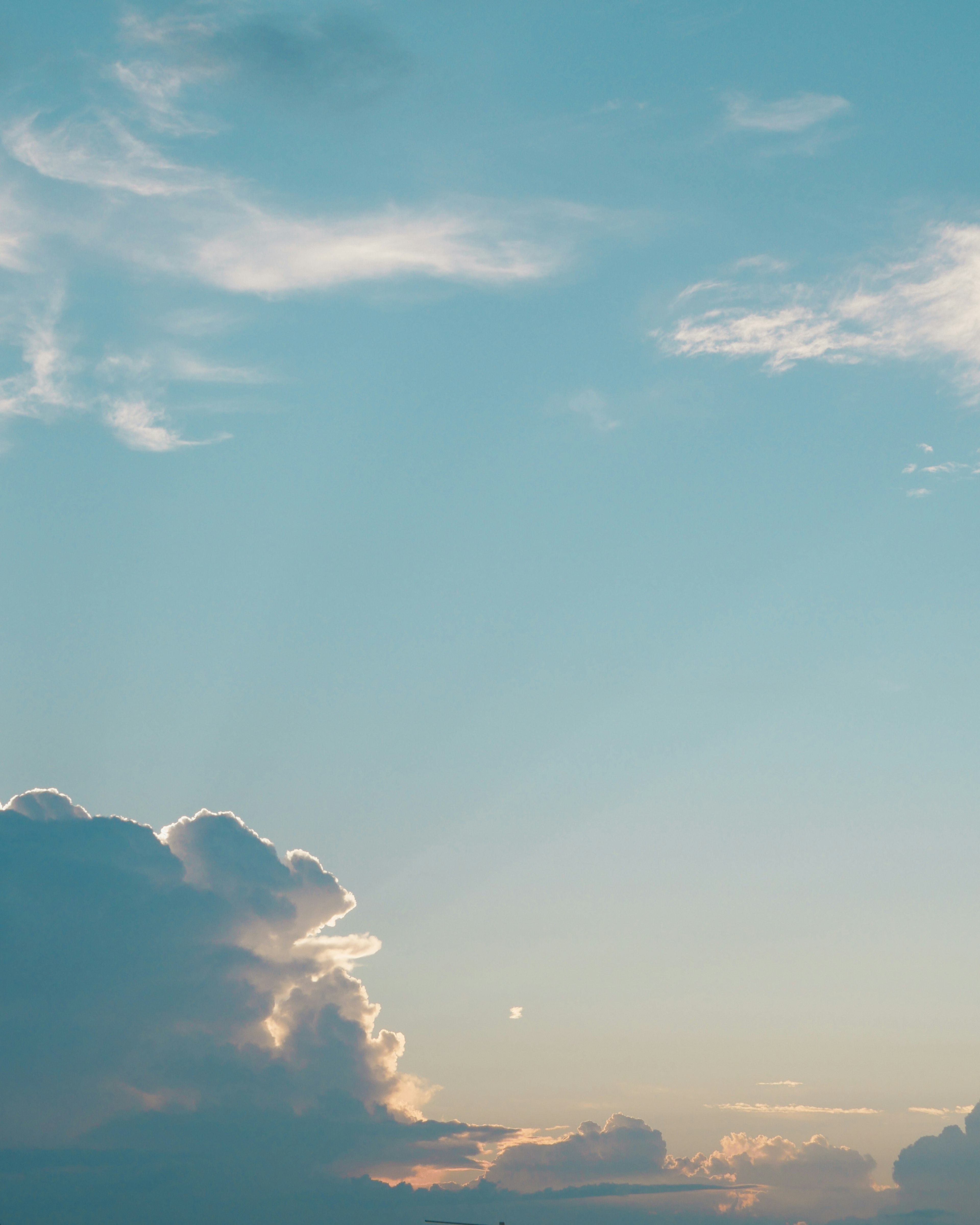 A beautiful sky with soft light shining through clouds and blue hues