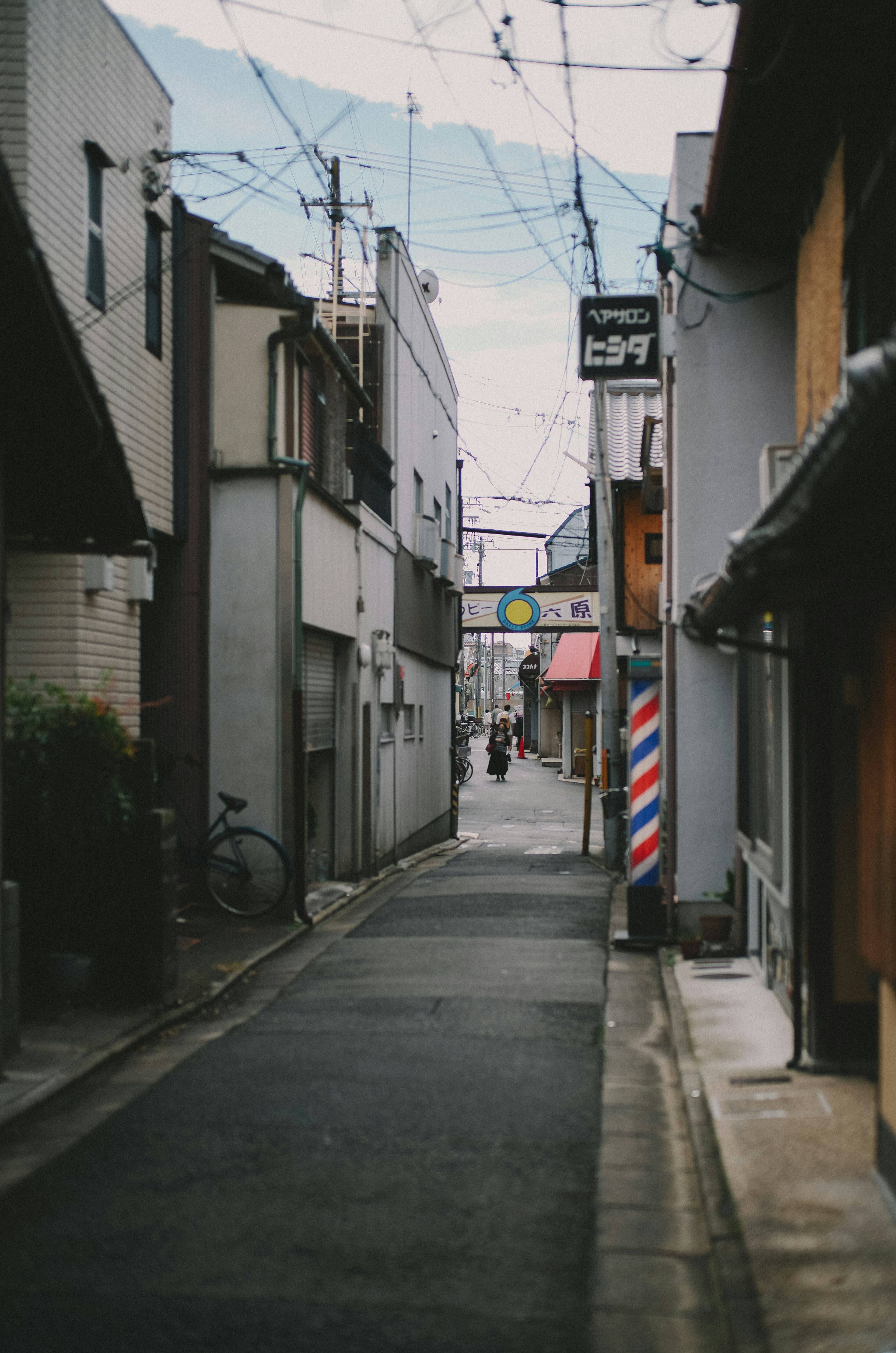 Quiet alley with town buildings and barber shop sign