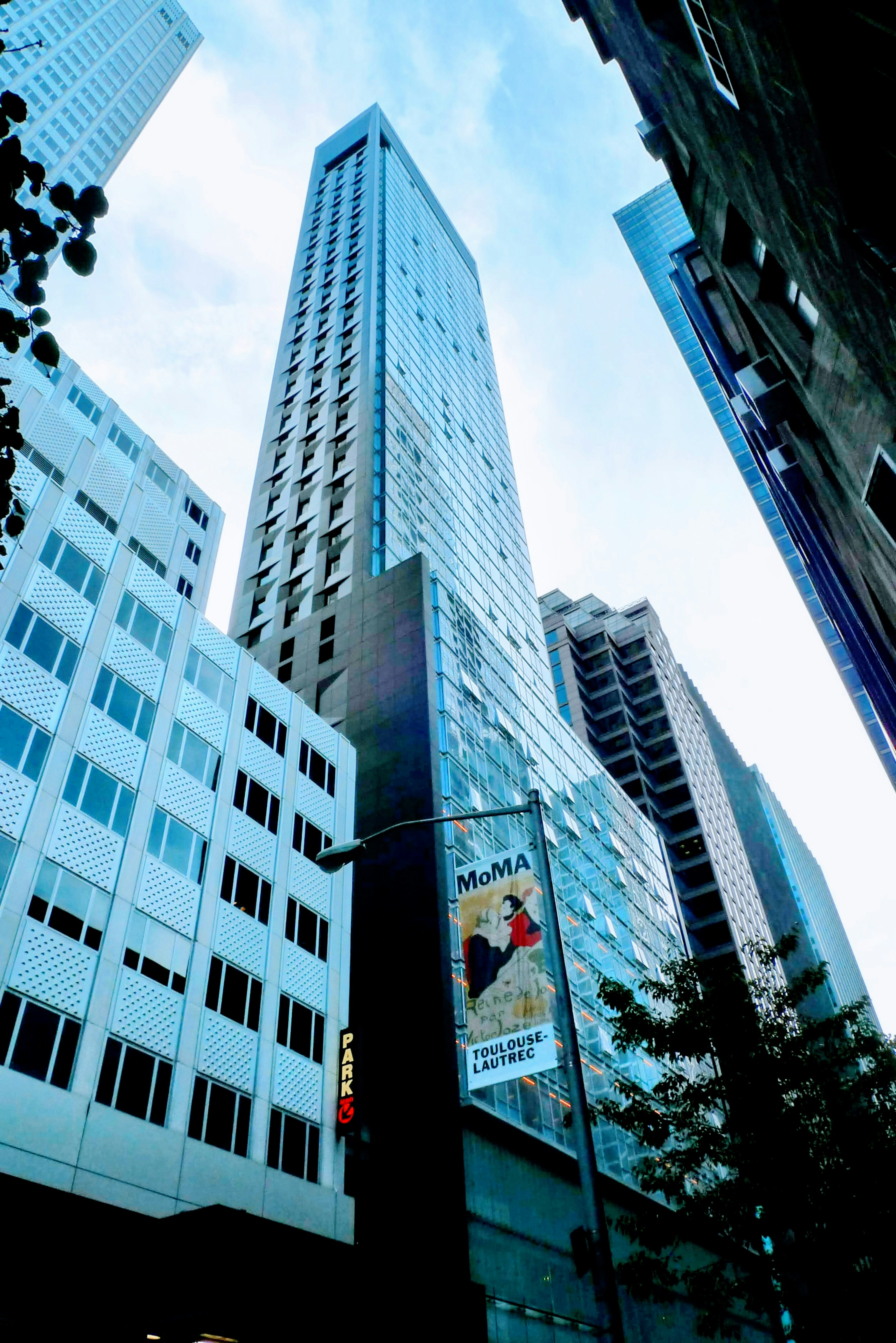 Photo of a skyscraper with urban scenery blue sky and building facade