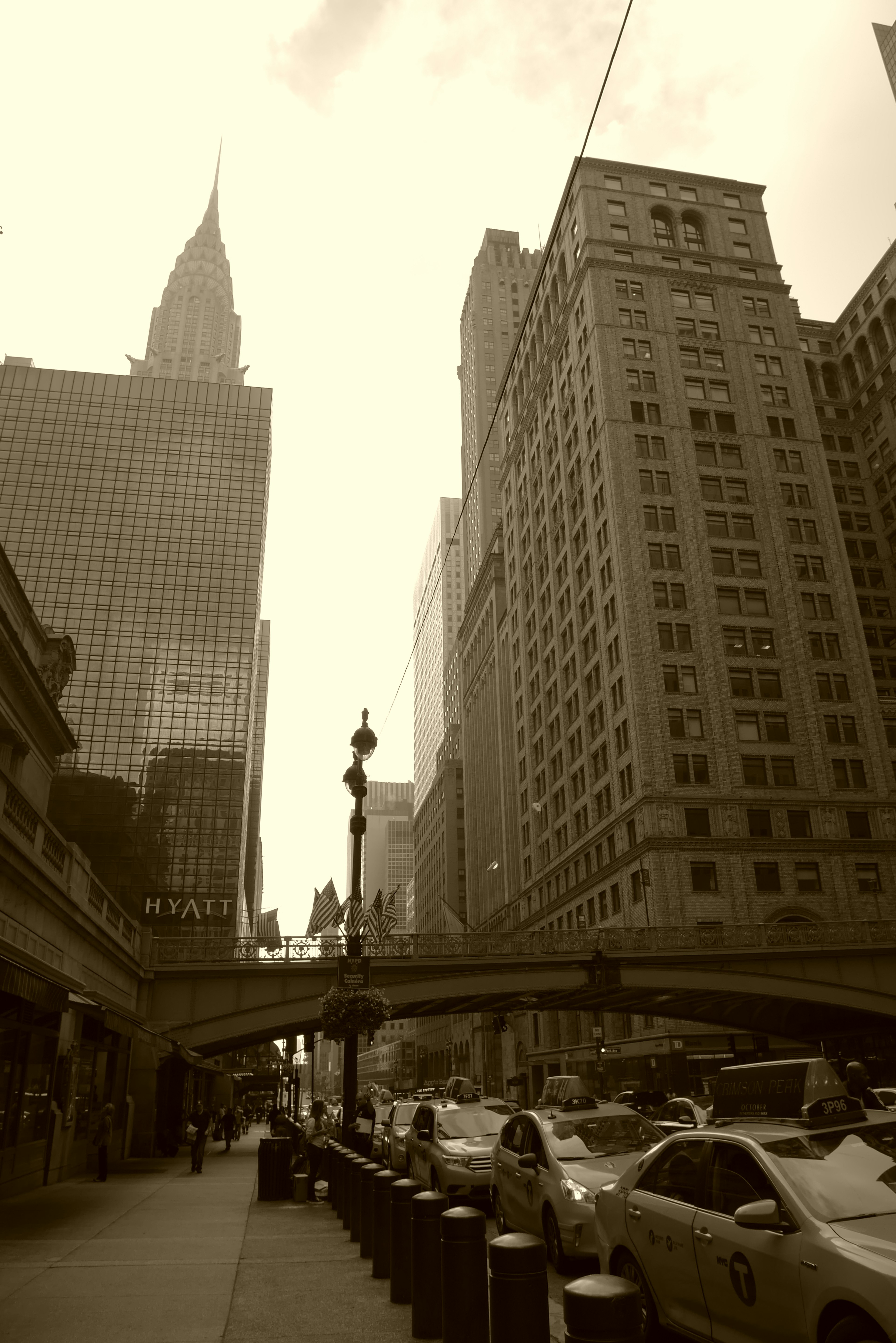 New York street view featuring the Empire State Building old architecture and parked taxis