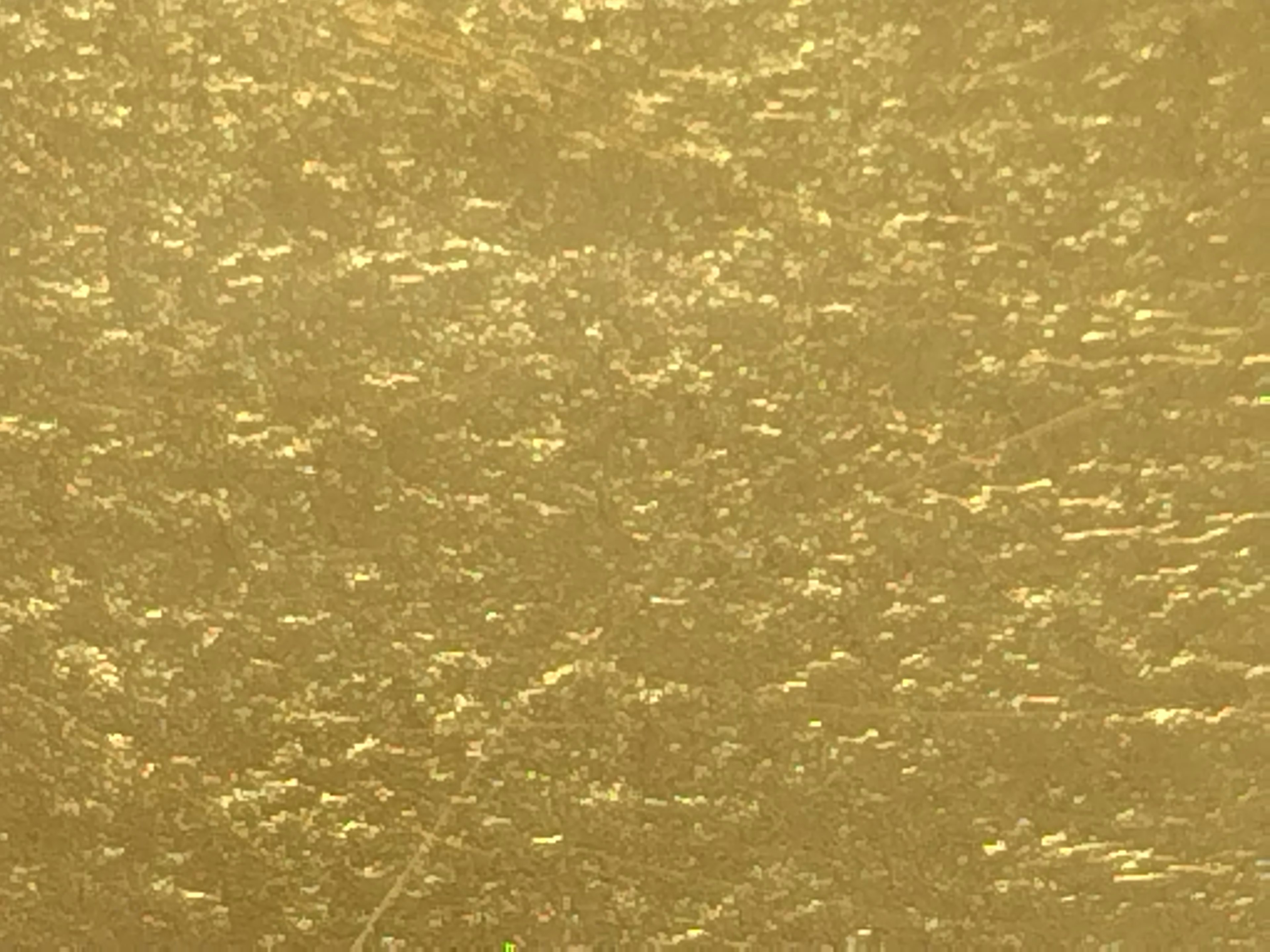 Textured surface in vibrant gold color