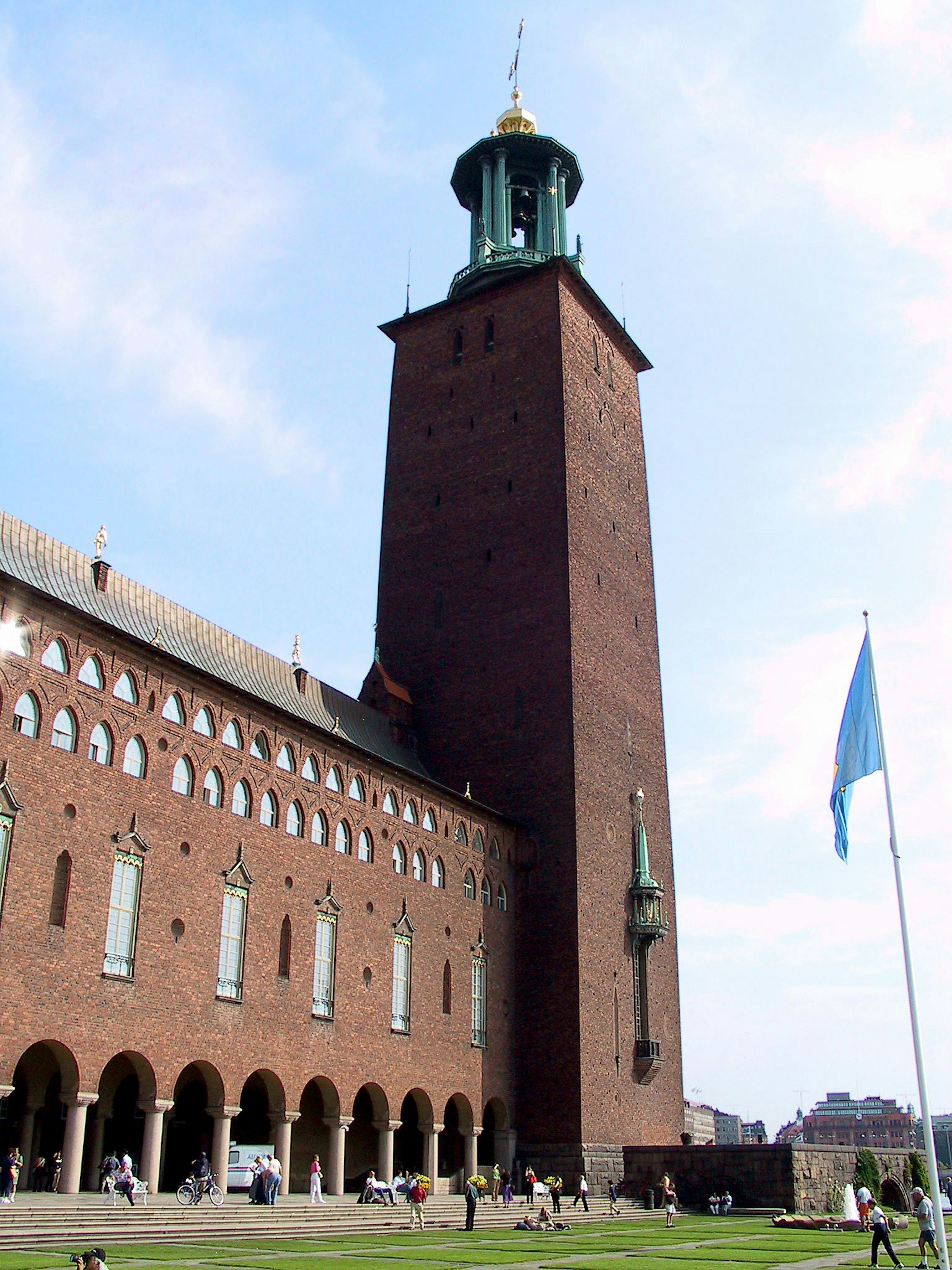 Stockholm City Hall featuring a red brick tower against a blue sky