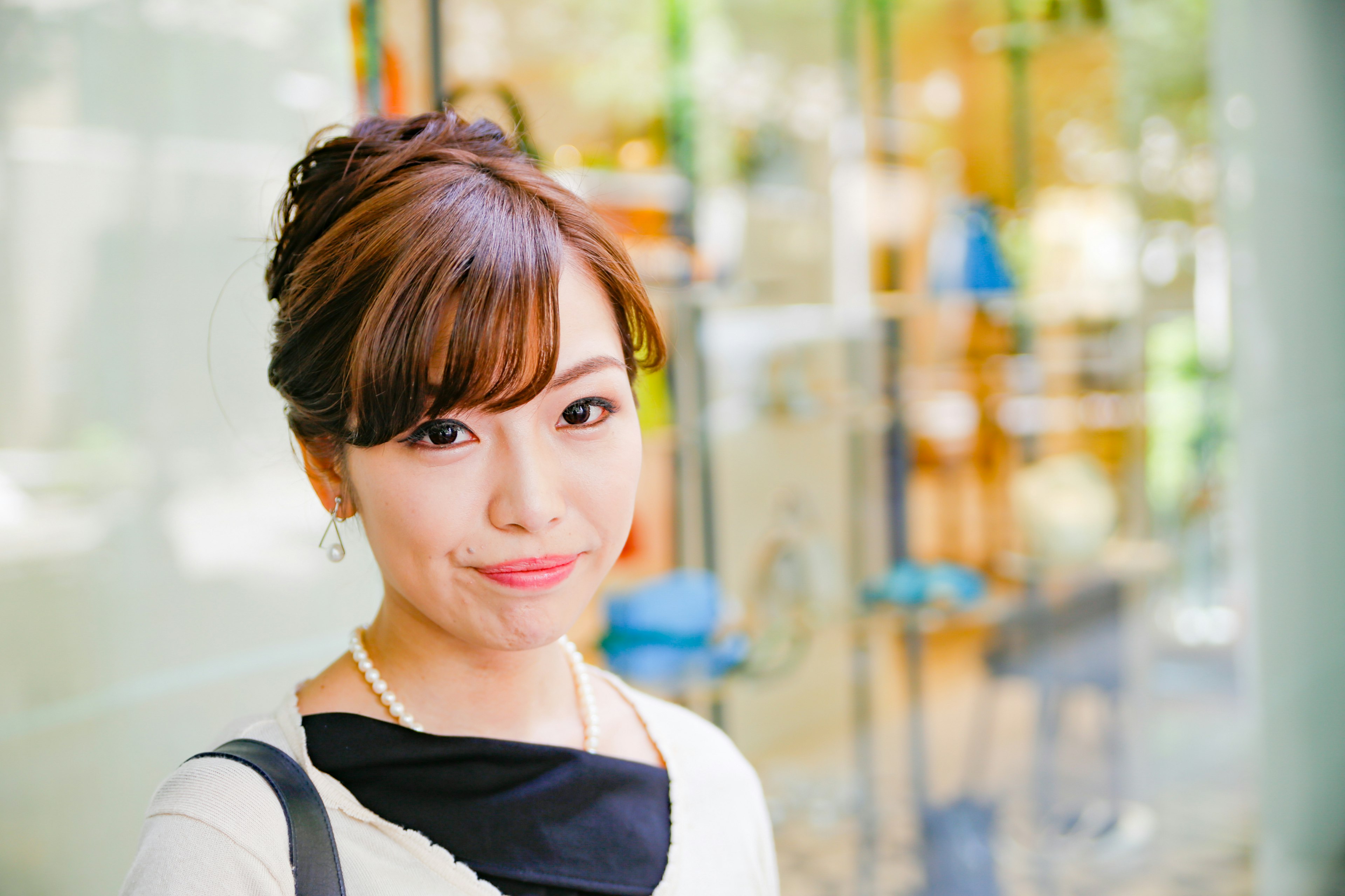 Portrait of a smiling woman with a bright background