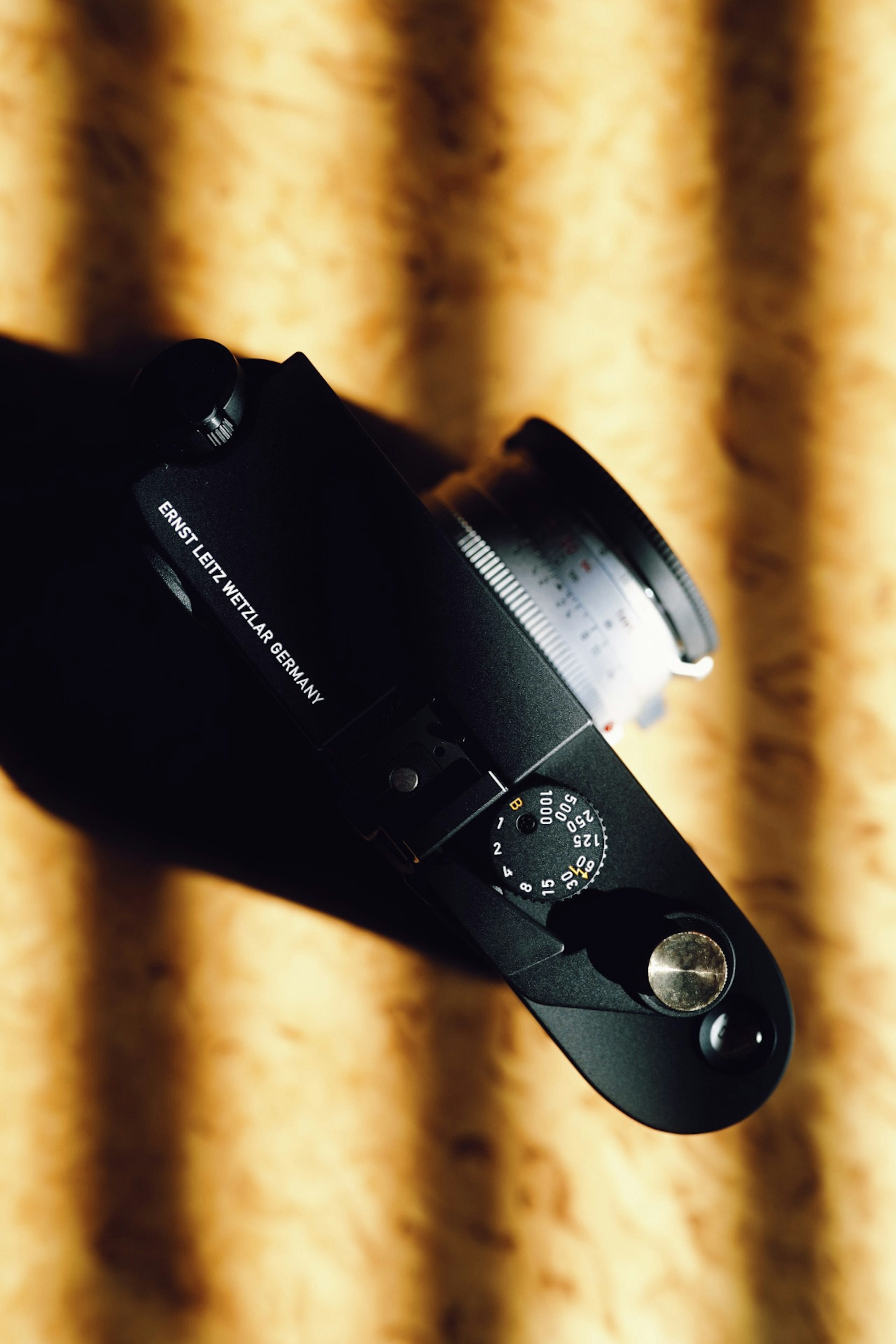 Top view of a camera with stripes of light and shadow