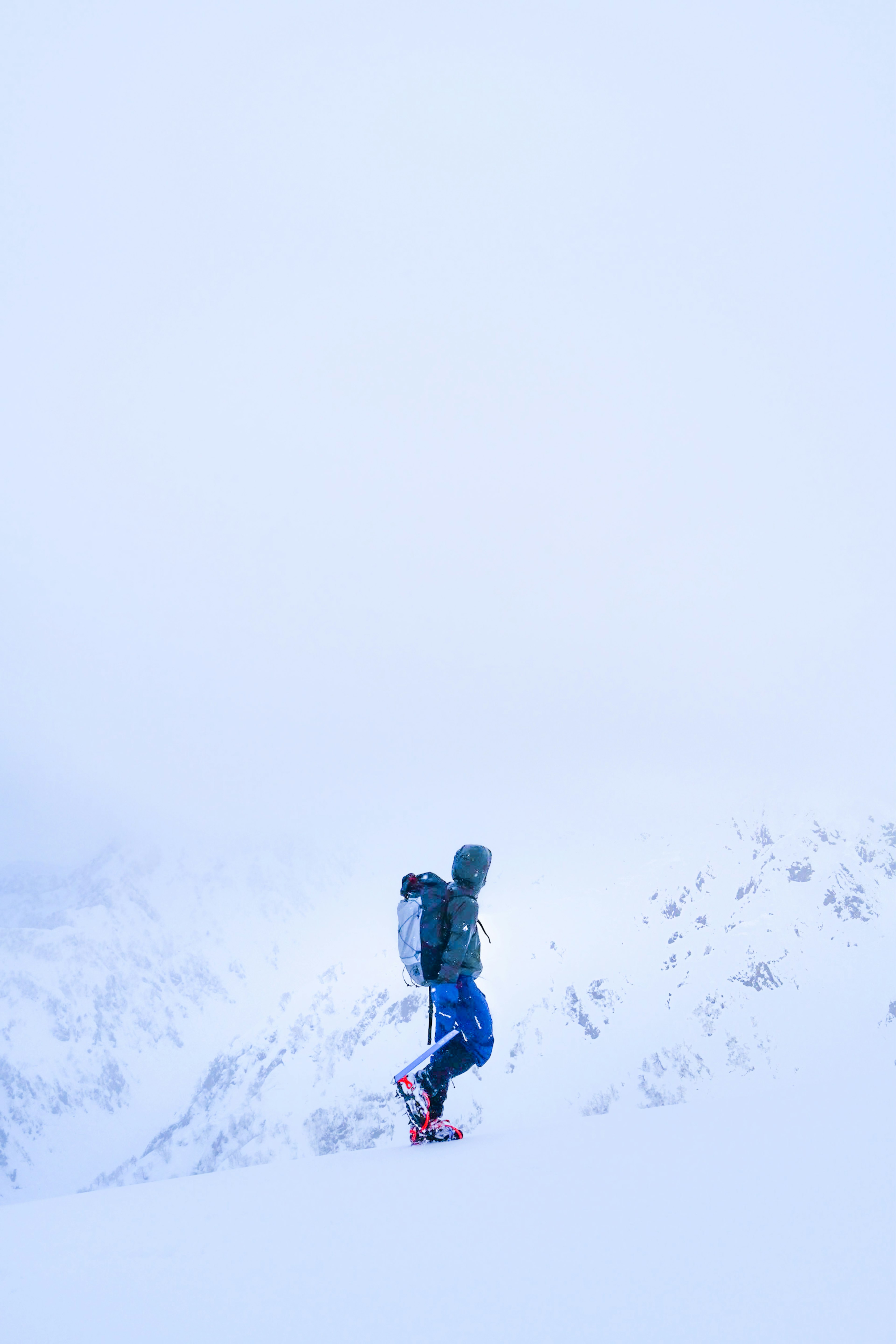 Silhouette of a hiker walking in the snow