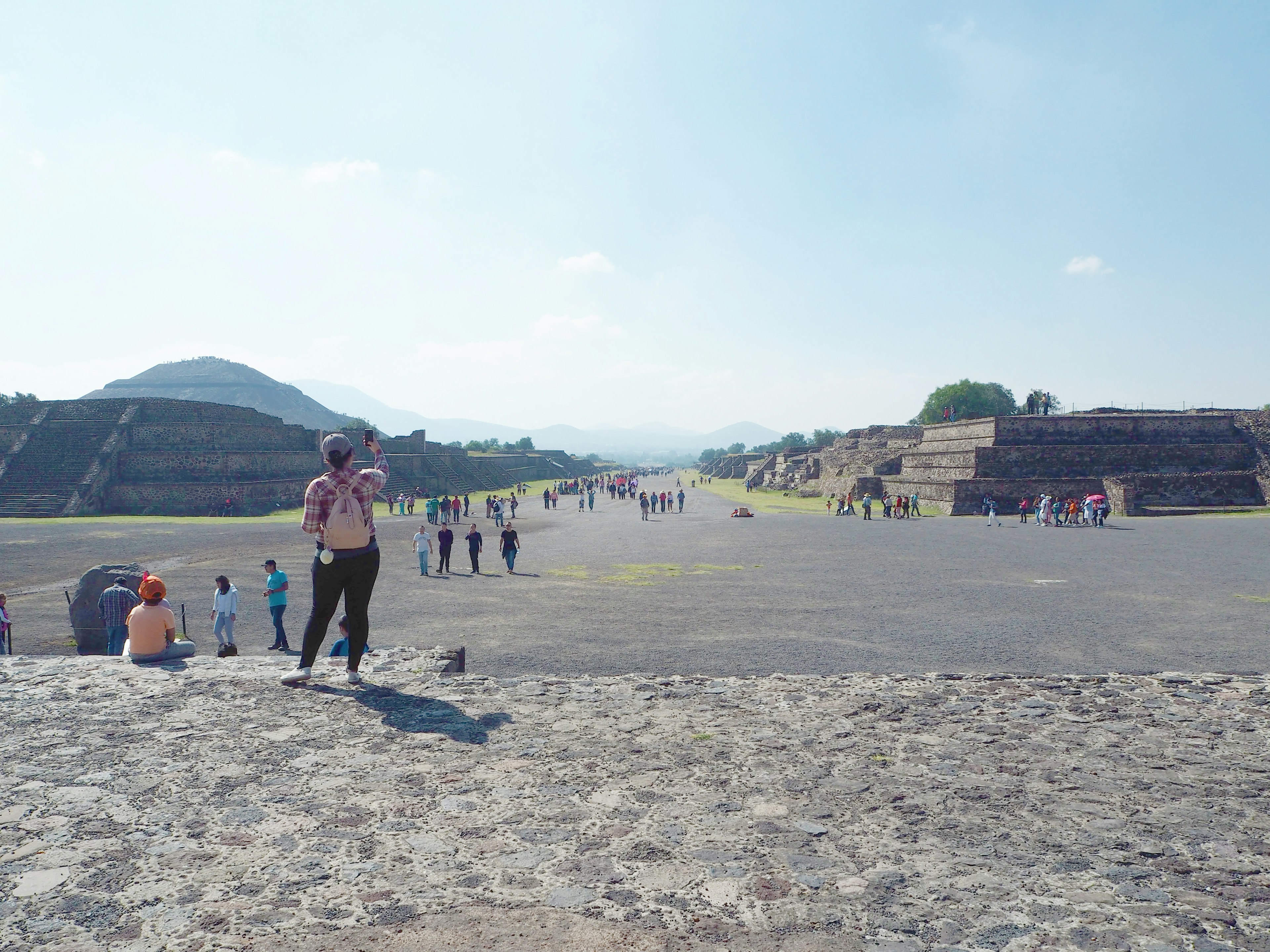 View of the expansive Avenue of the Dead with ancient pyramids at Teotihuacan