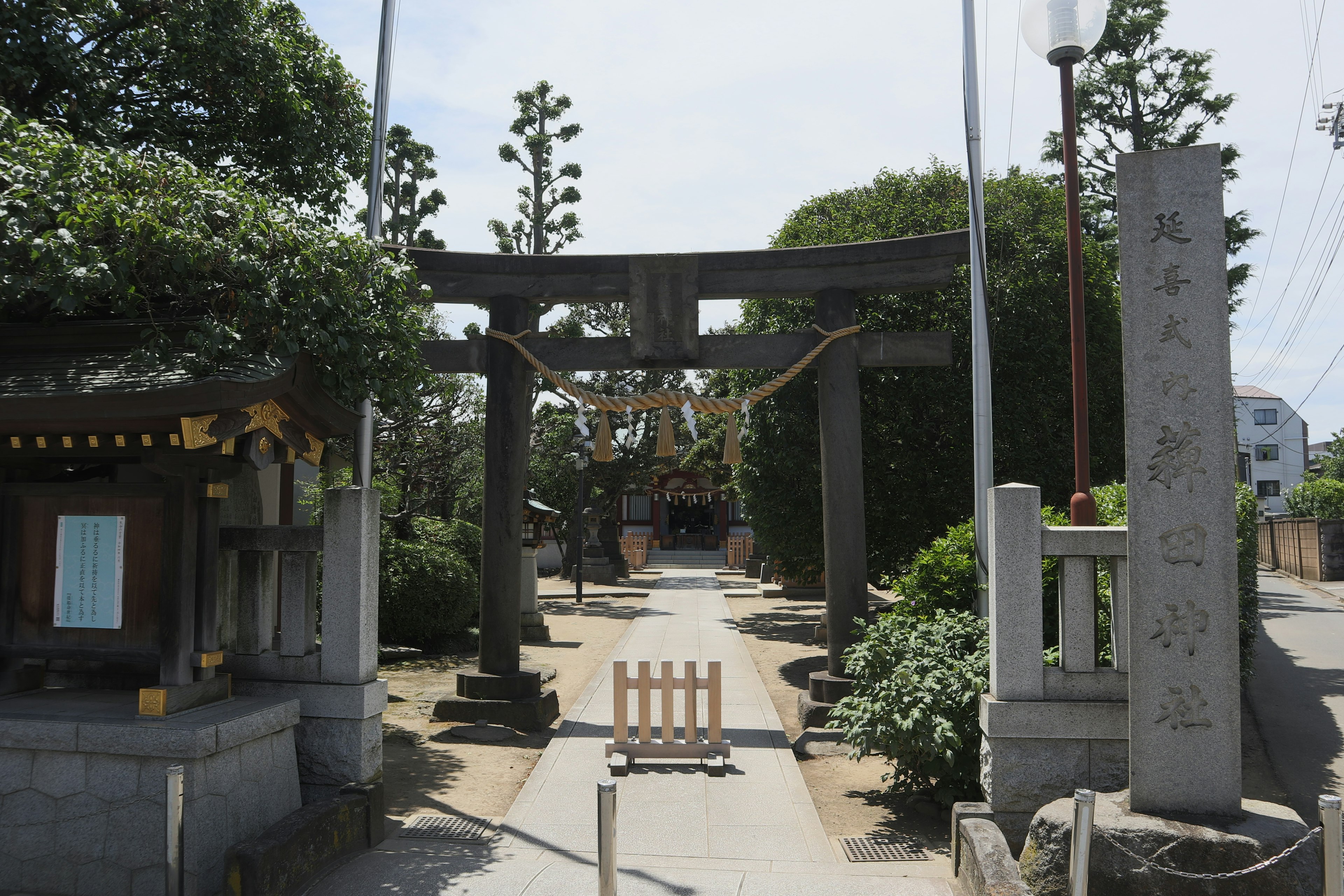 View of a shrine's torii gate and pathway