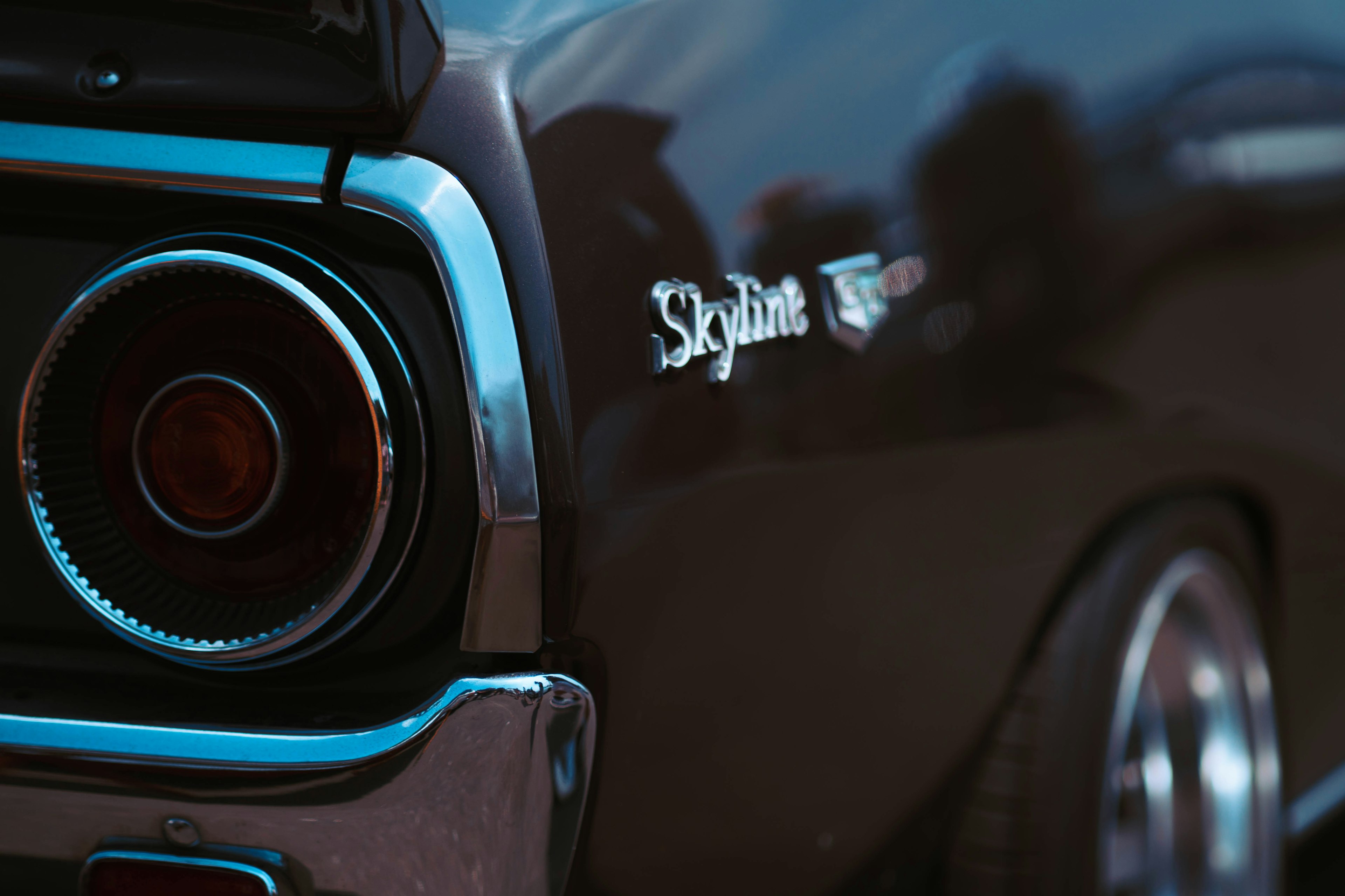 Close-up of a Nissan Skyline rear end featuring distinctive taillights and logo