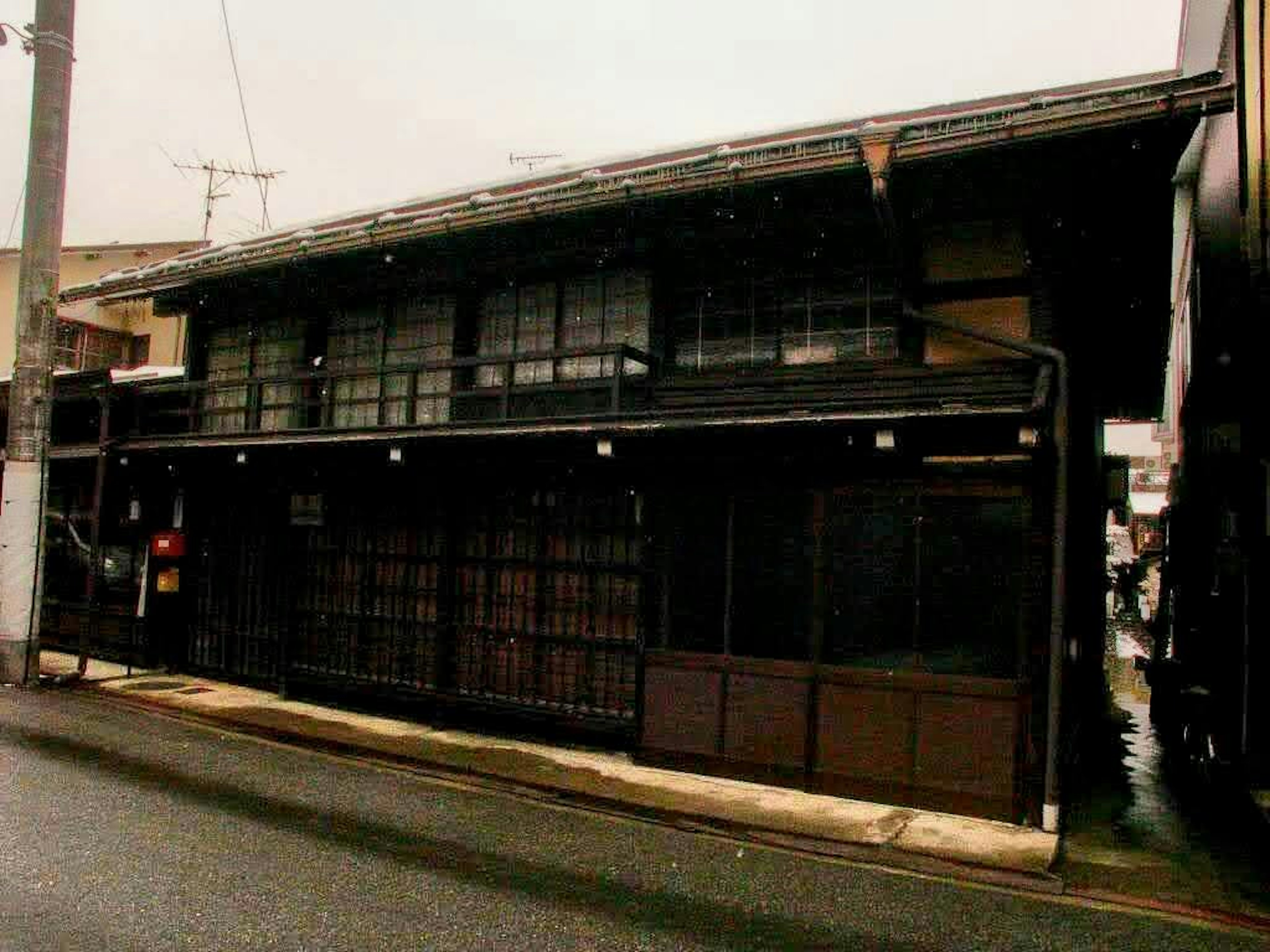 Traditional Japanese house exterior with dark wooden structure