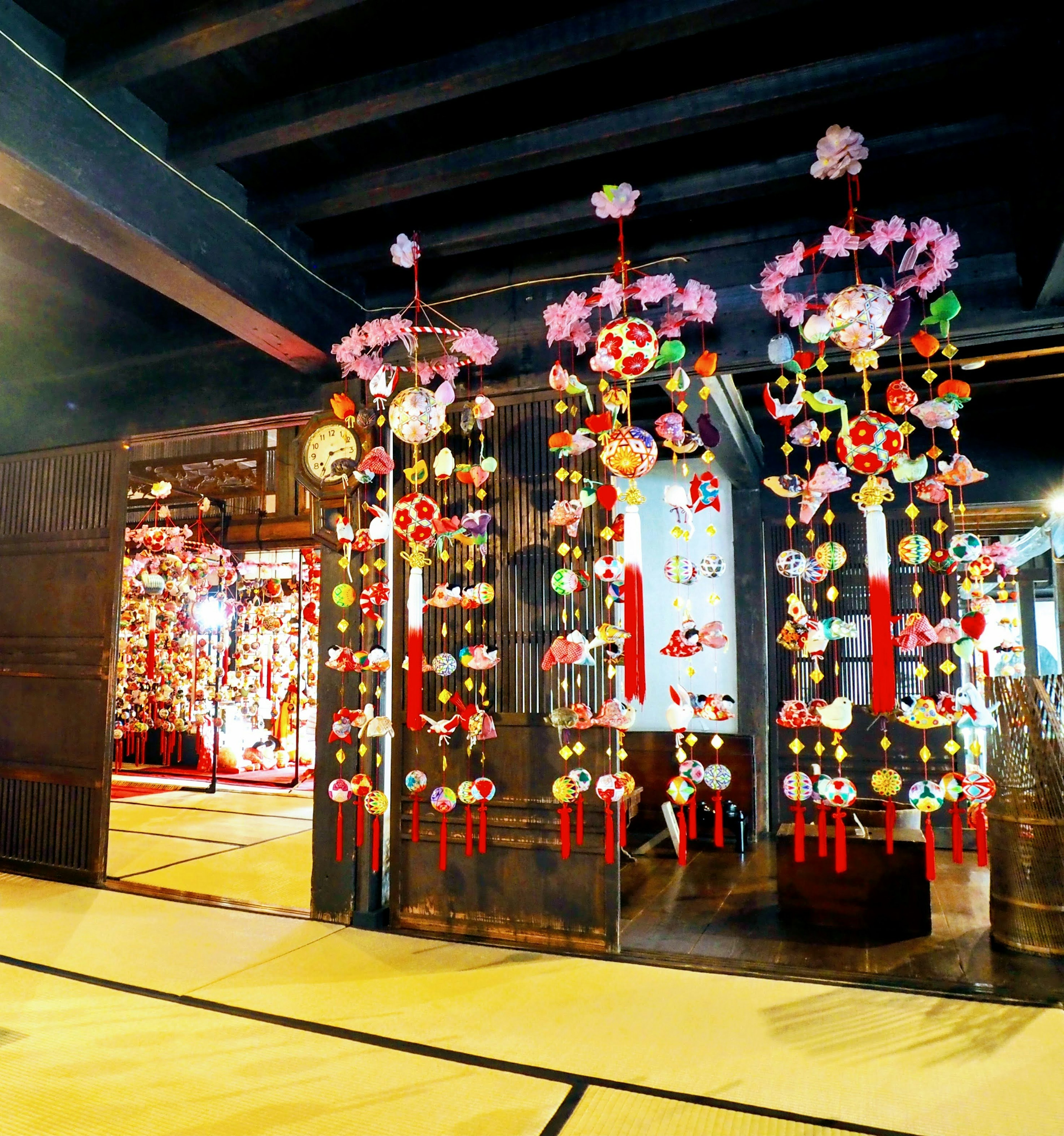 Colorful traditional Japanese decorations hanging at the entrance of a room