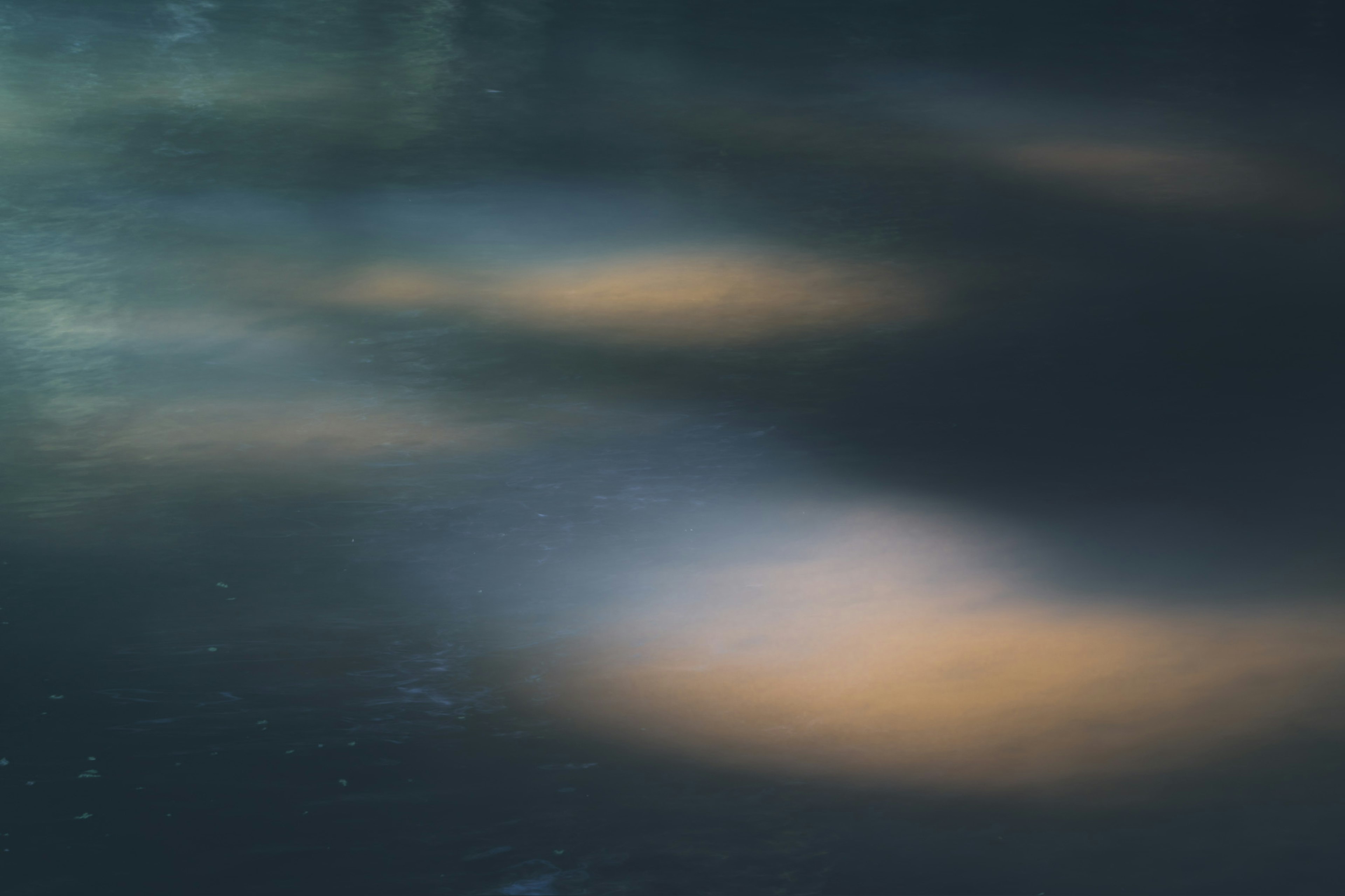 Abstract view of light reflections and soft colors on water surface