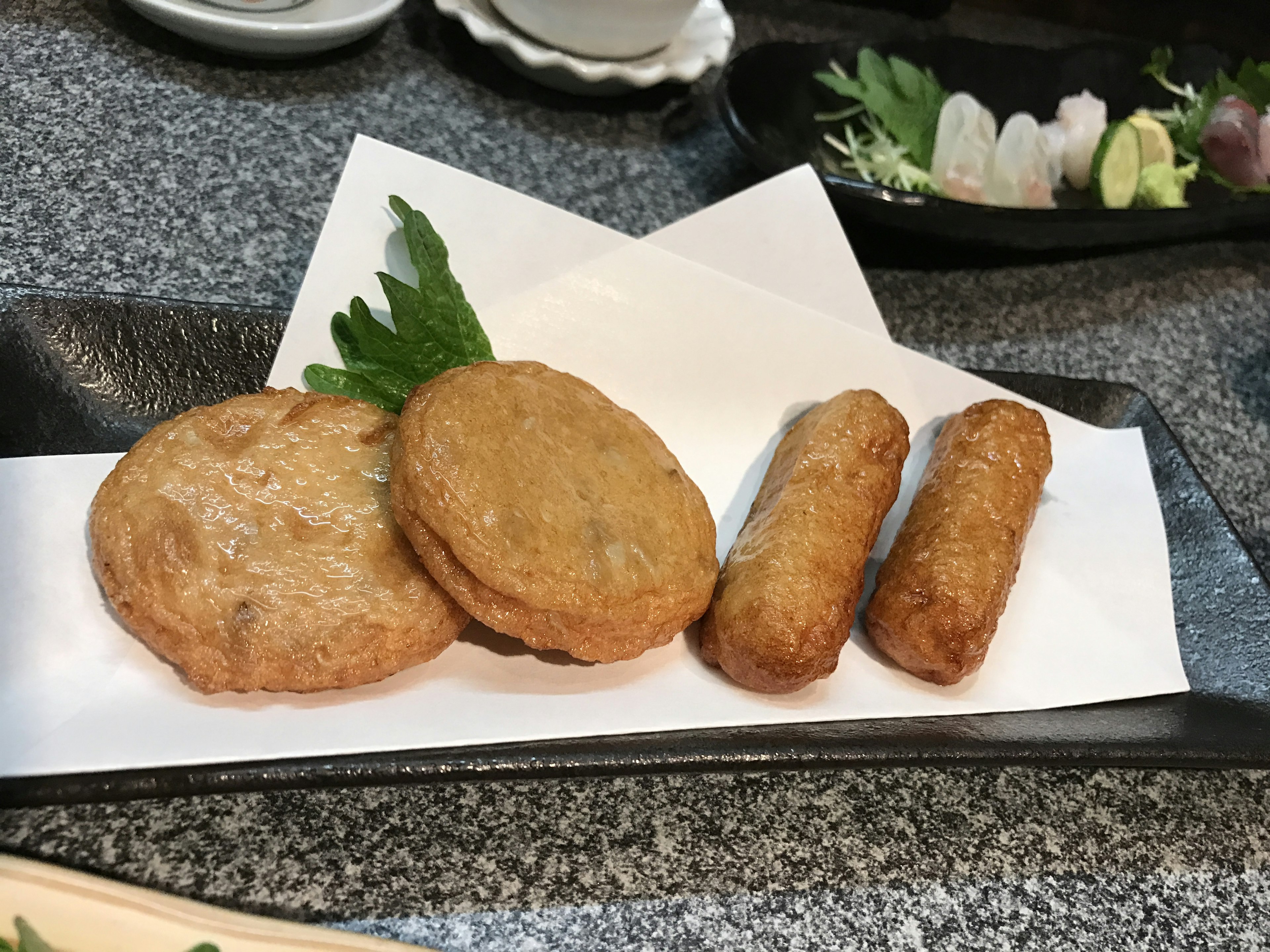 Plate of fried dishes including round and elongated shapes