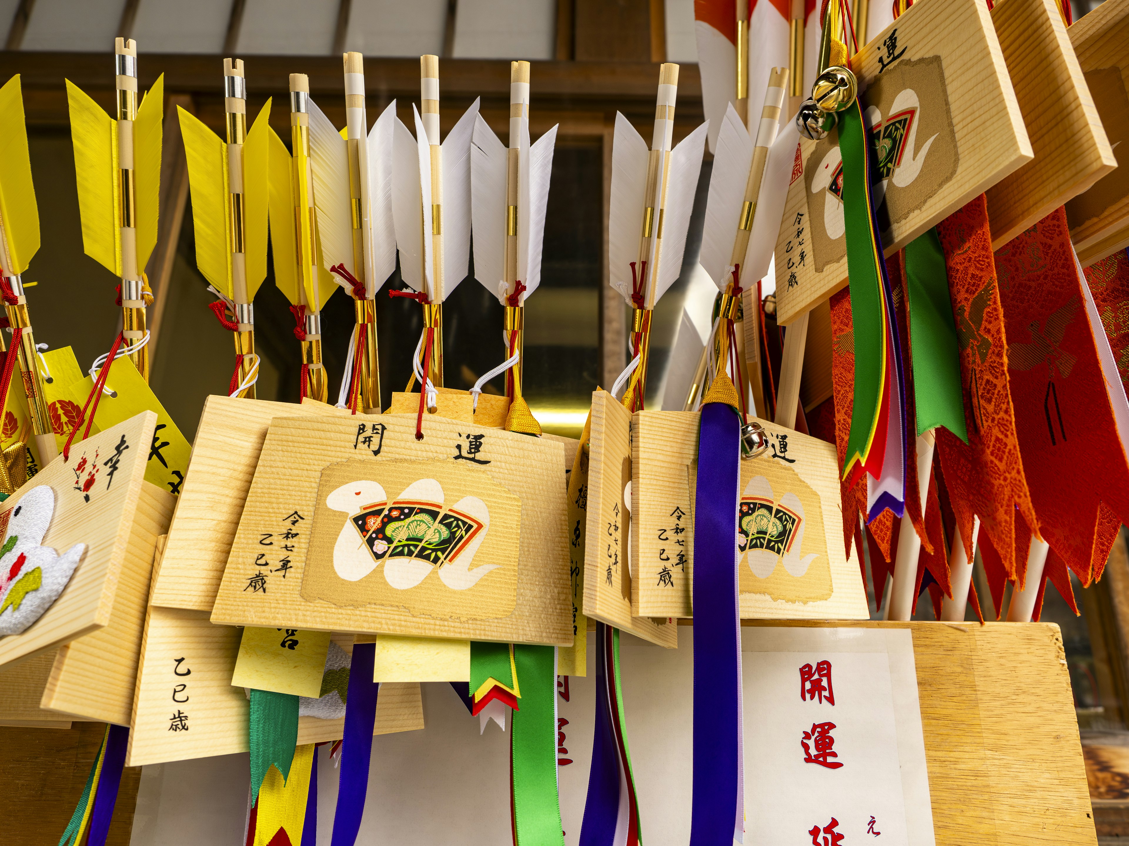 Colorful ema plaques hanging in a shrine