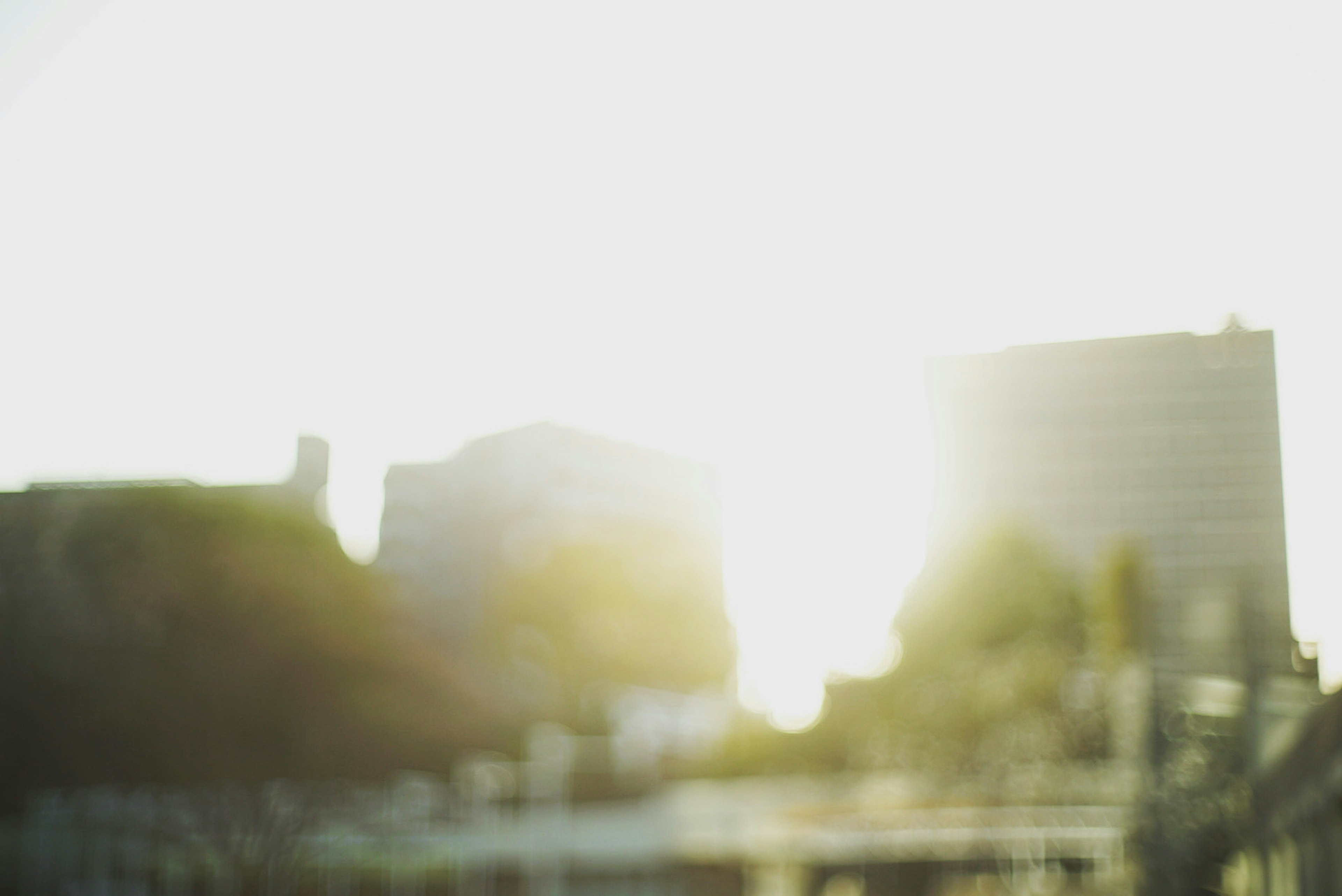 Blurred cityscape with bright sunlight