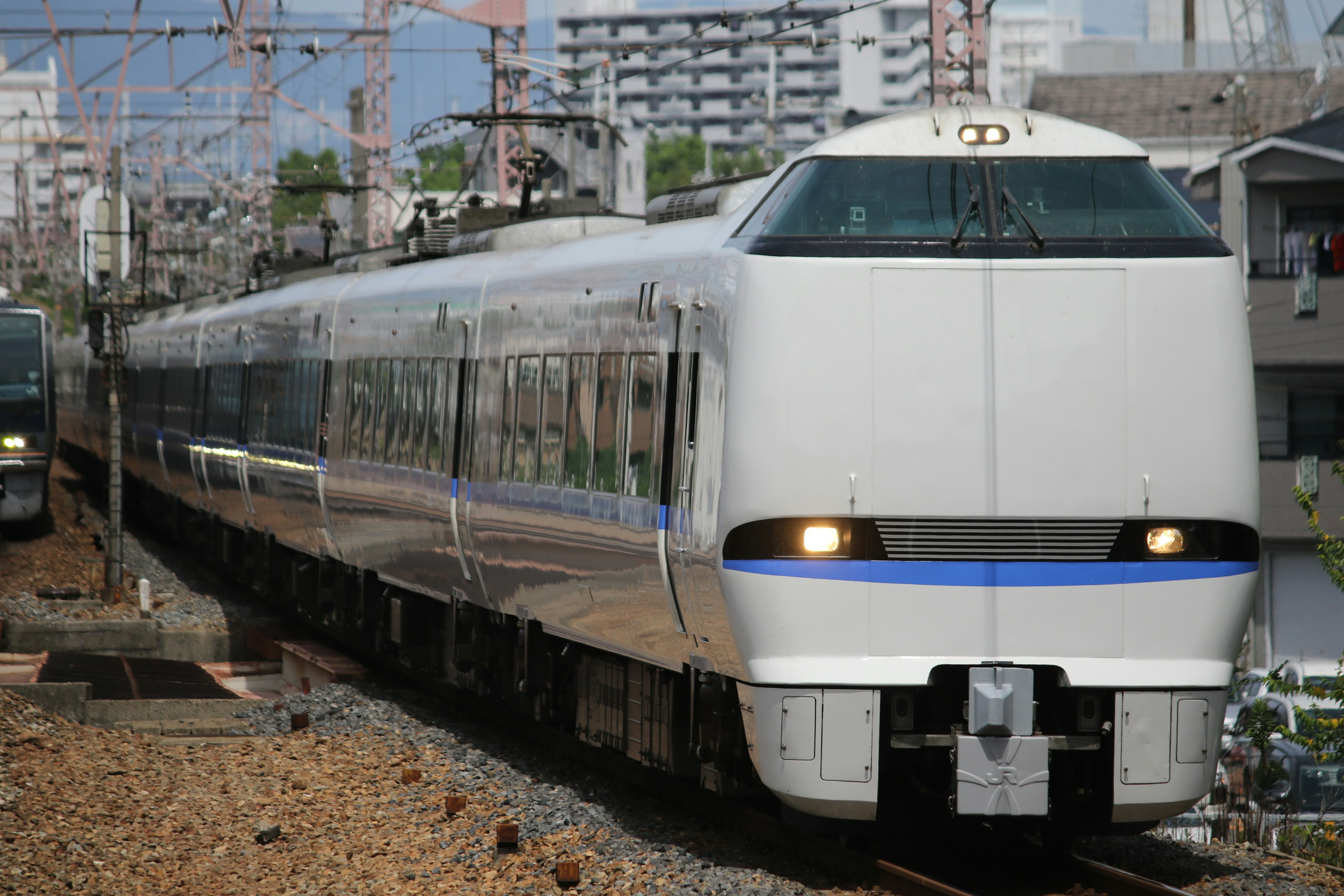 Shinkansen train in motion on railway tracks