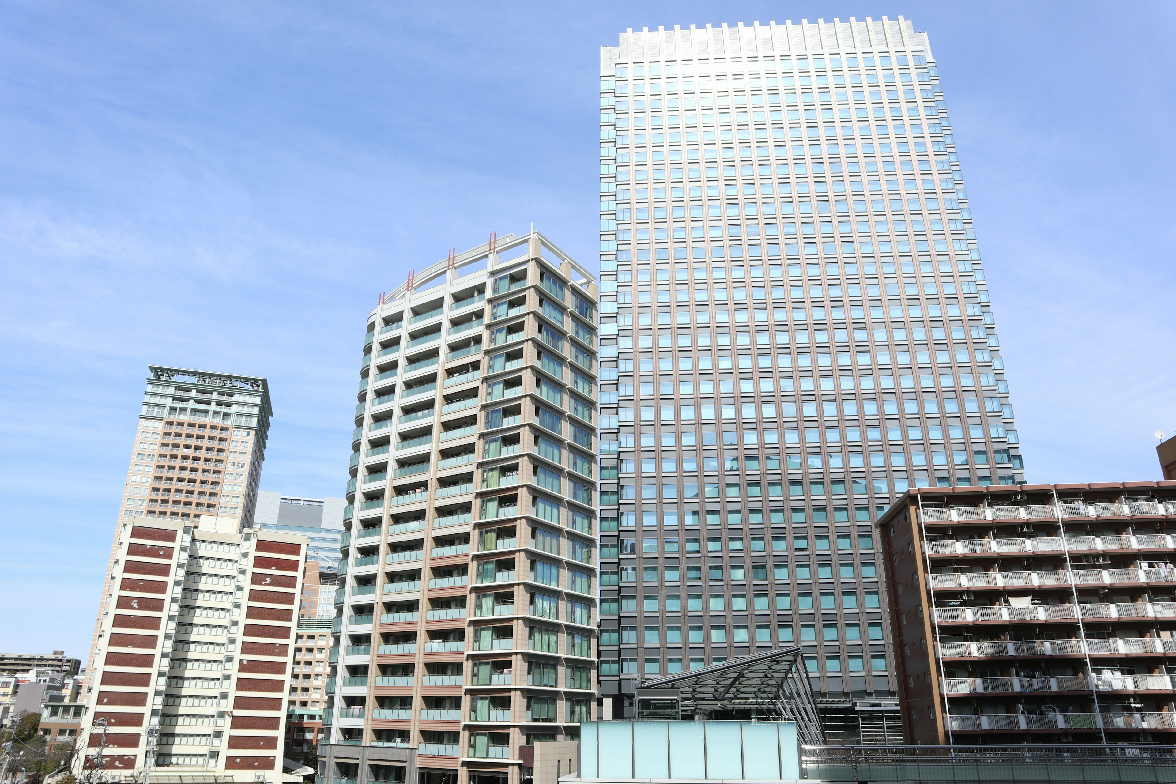 City skyline featuring modern buildings and glass structures