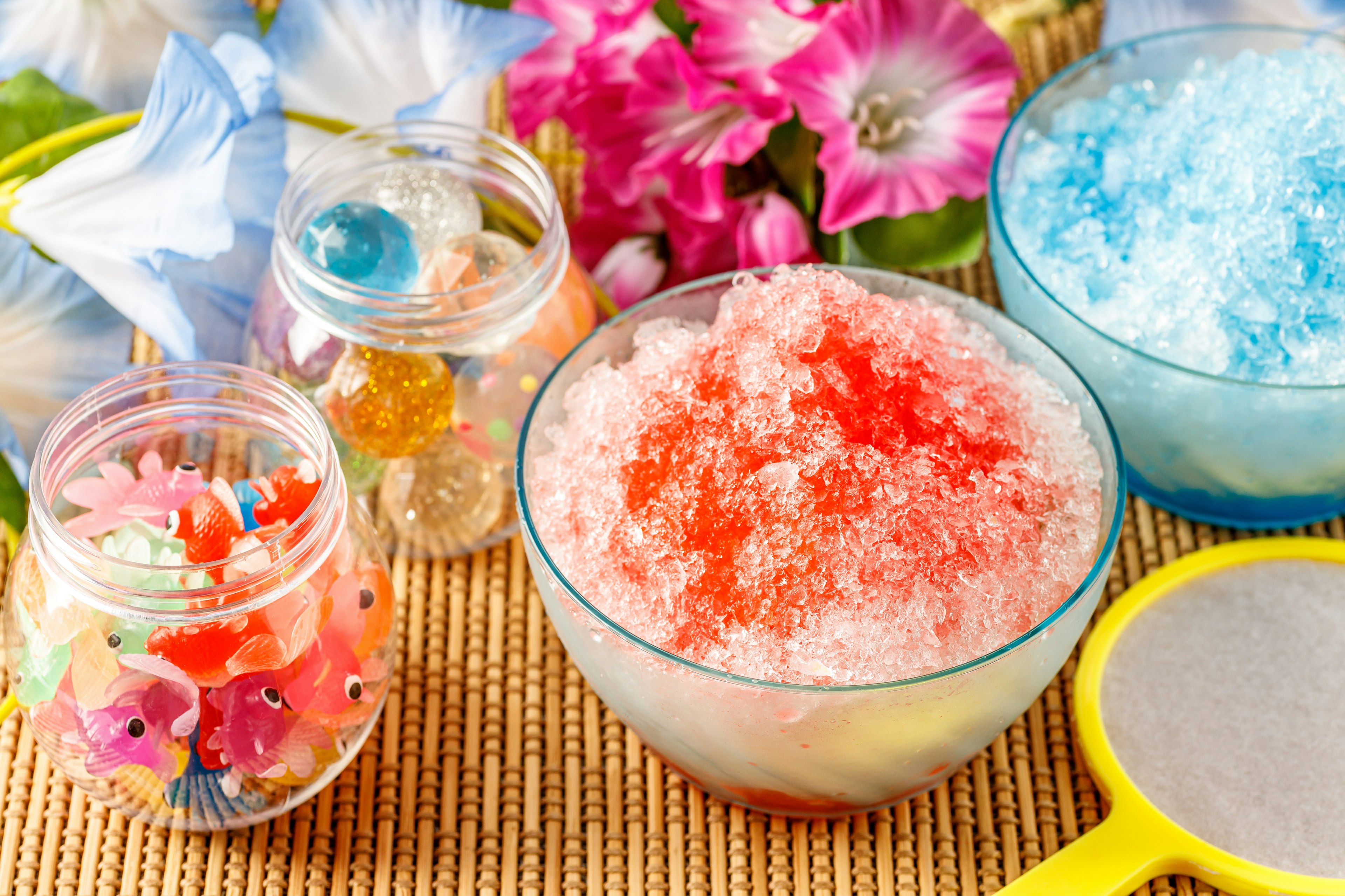 Colorful ice desserts with flowers on a table