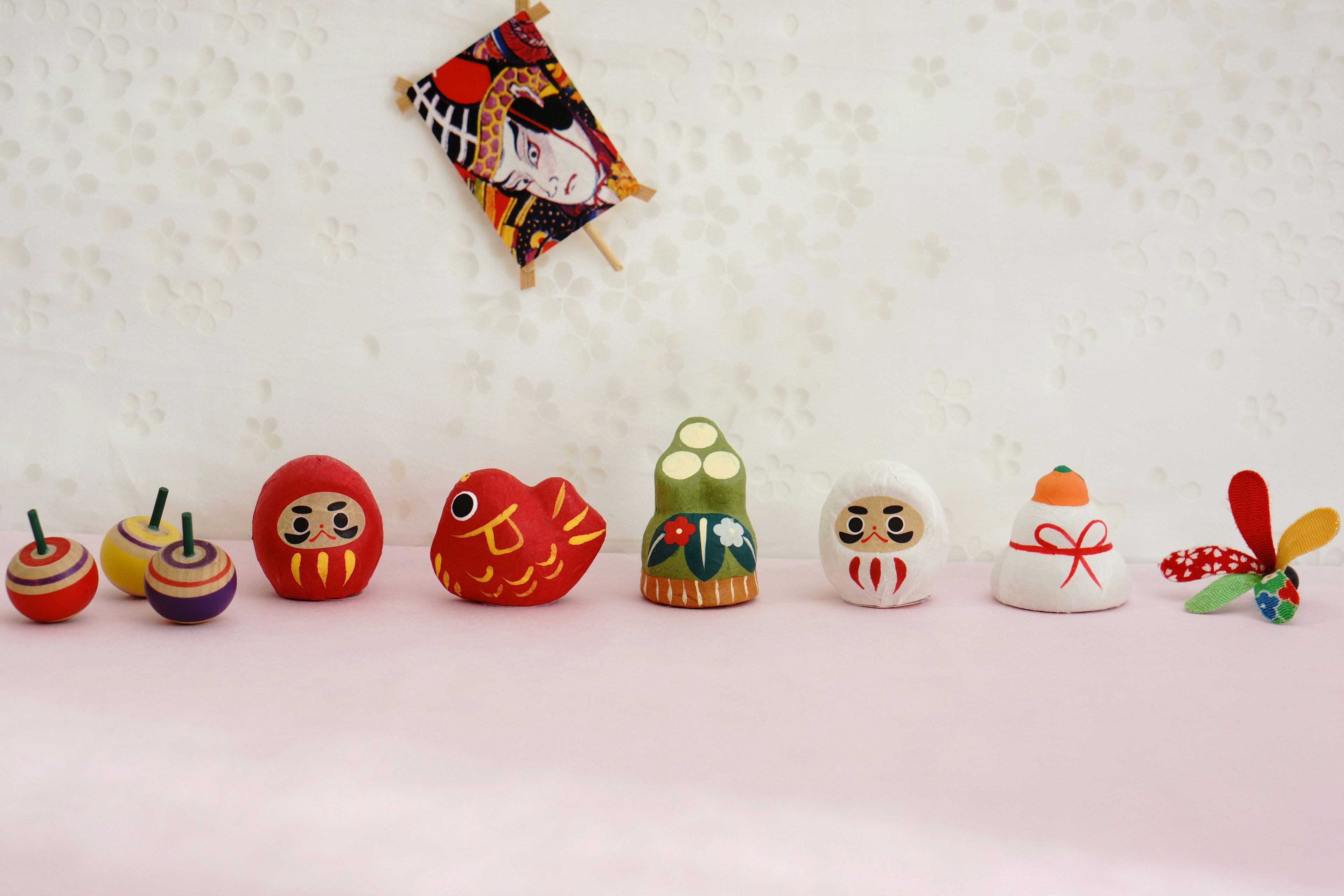 Colorful traditional dolls and ornaments arranged in a row