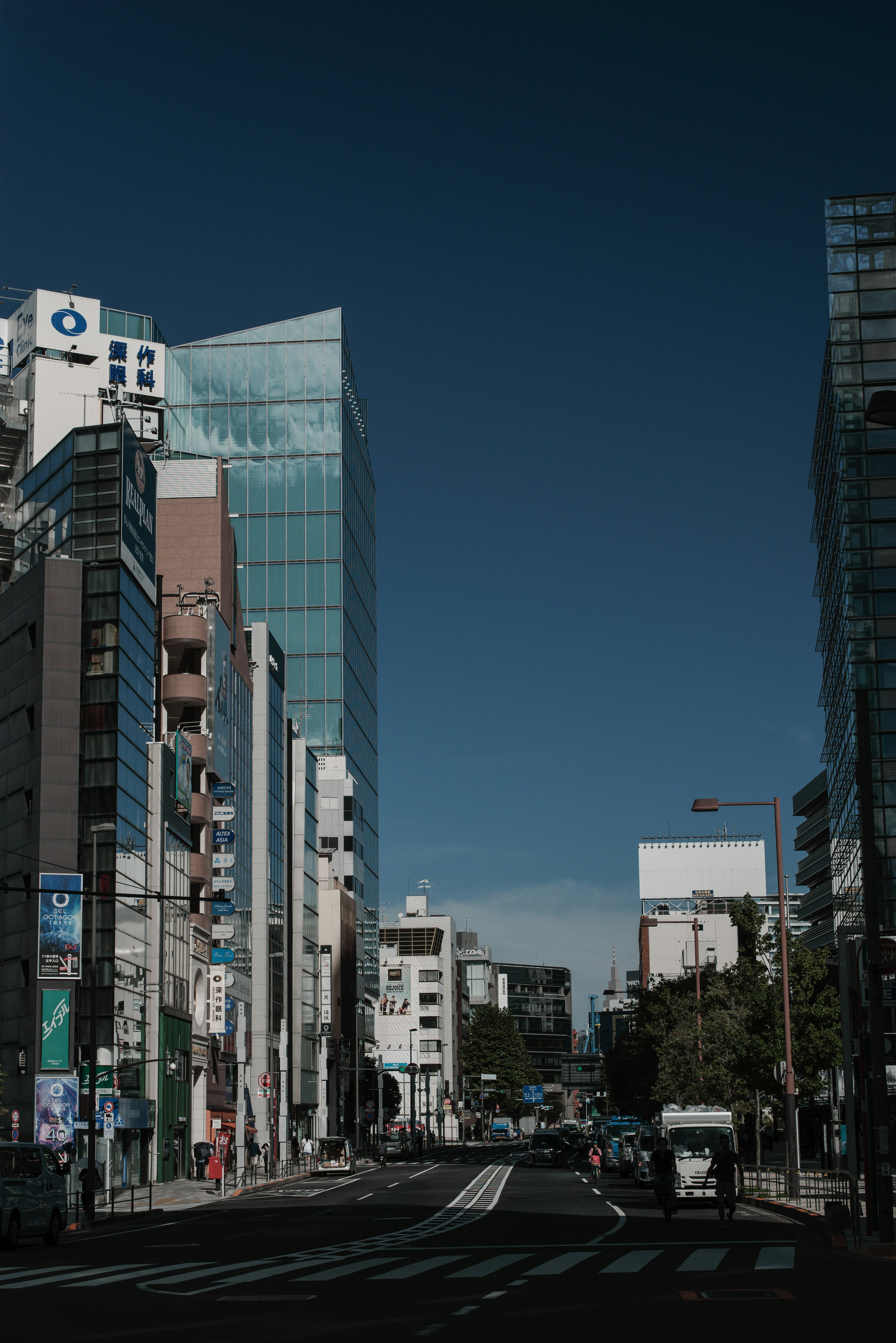 Urban landscape featuring tall buildings and a clear blue sky
