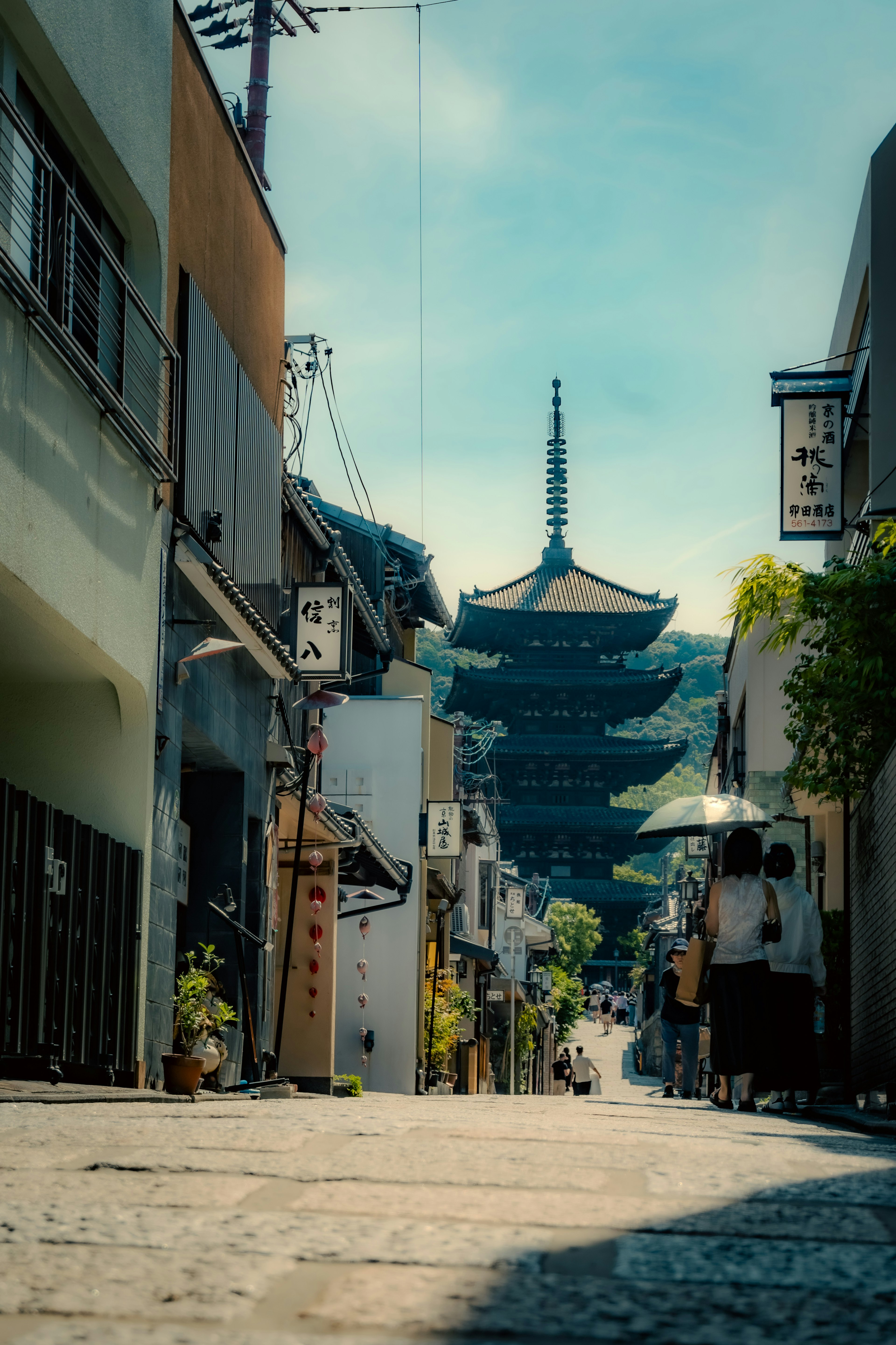 Scenic view of a five-story pagoda rising above a quiet street