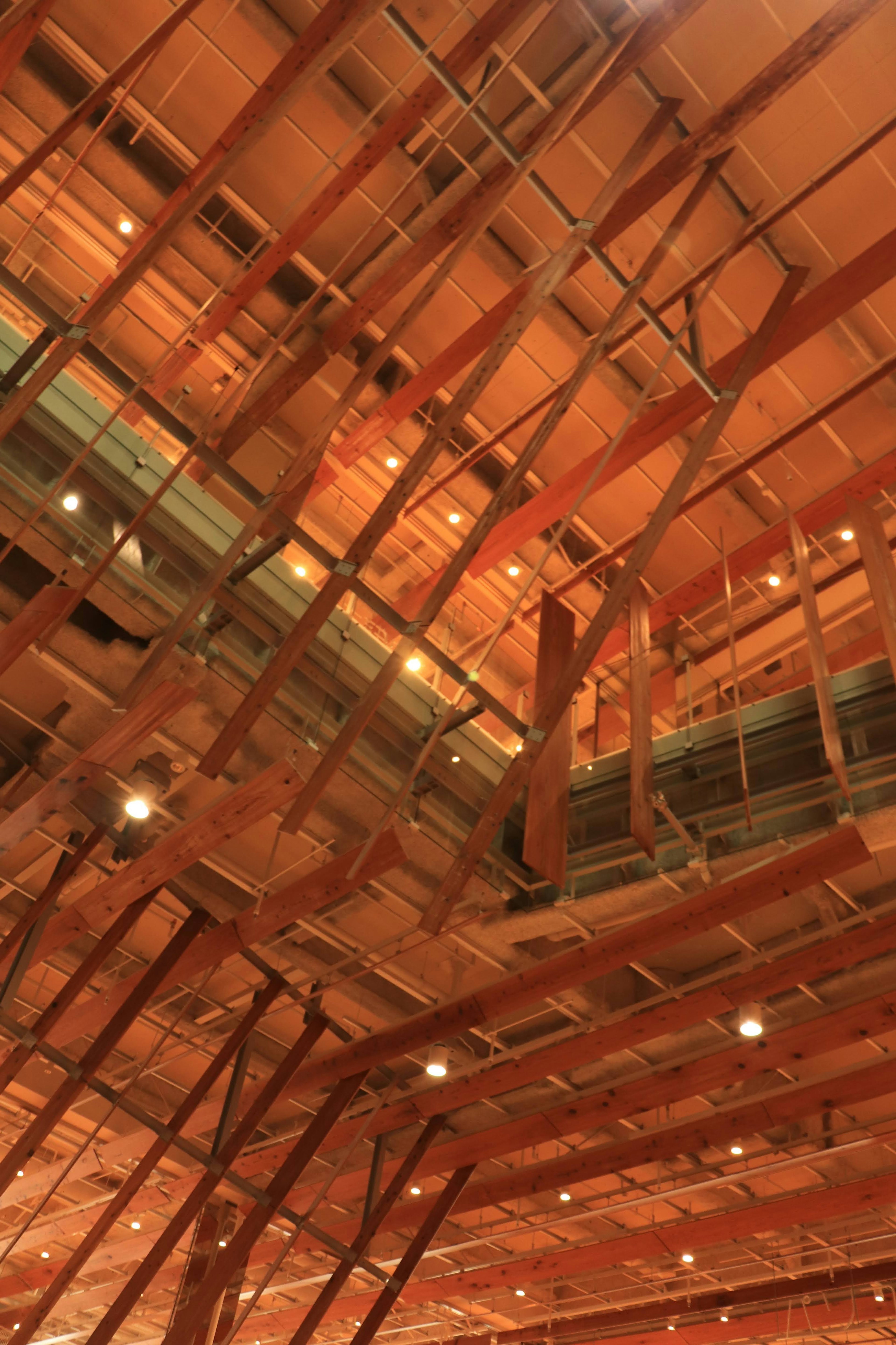 Ceiling showcasing wooden beams and ambient lighting in an indoor space