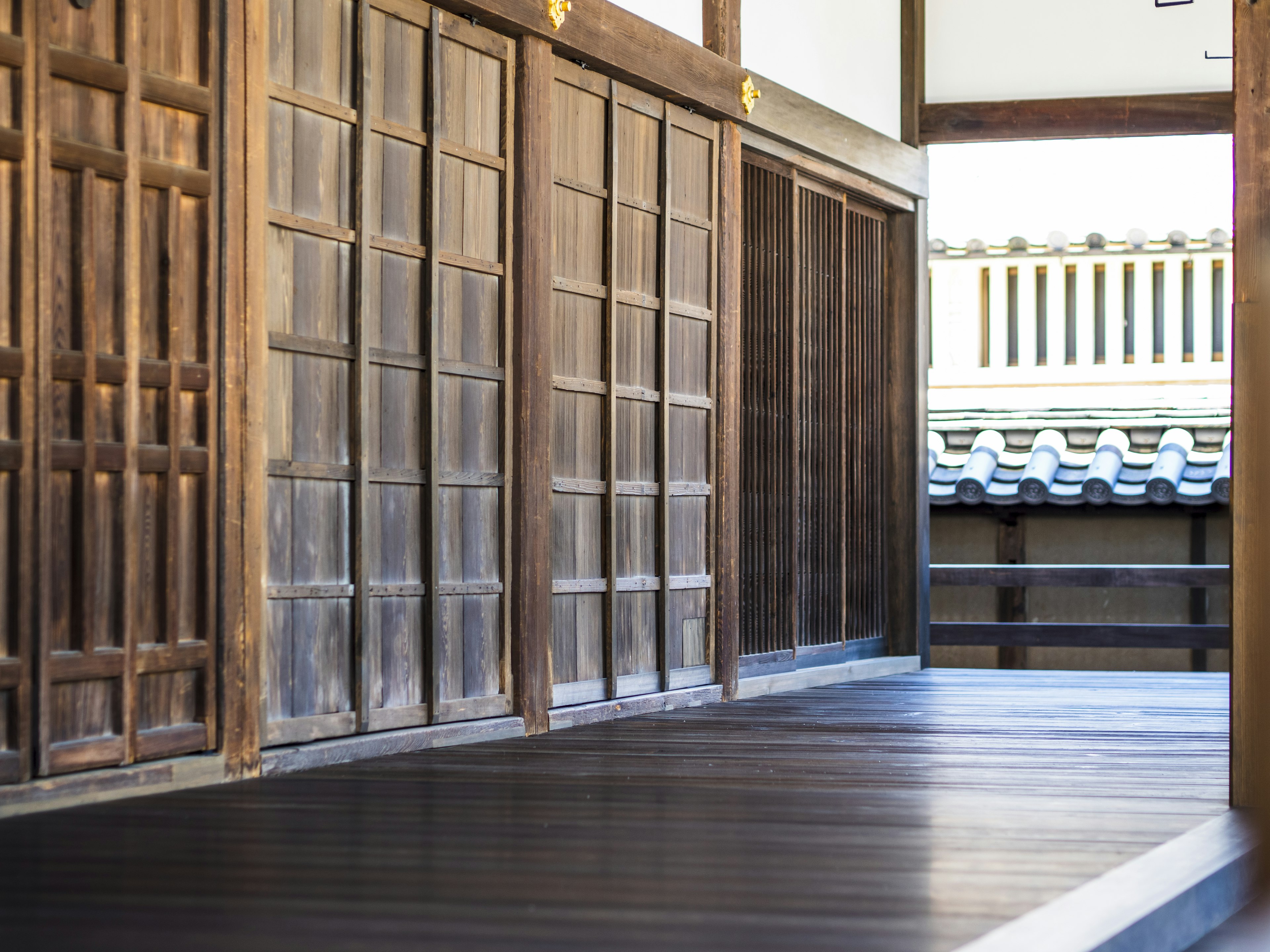 Traditional Japanese architectural corridor with wooden walls and floor